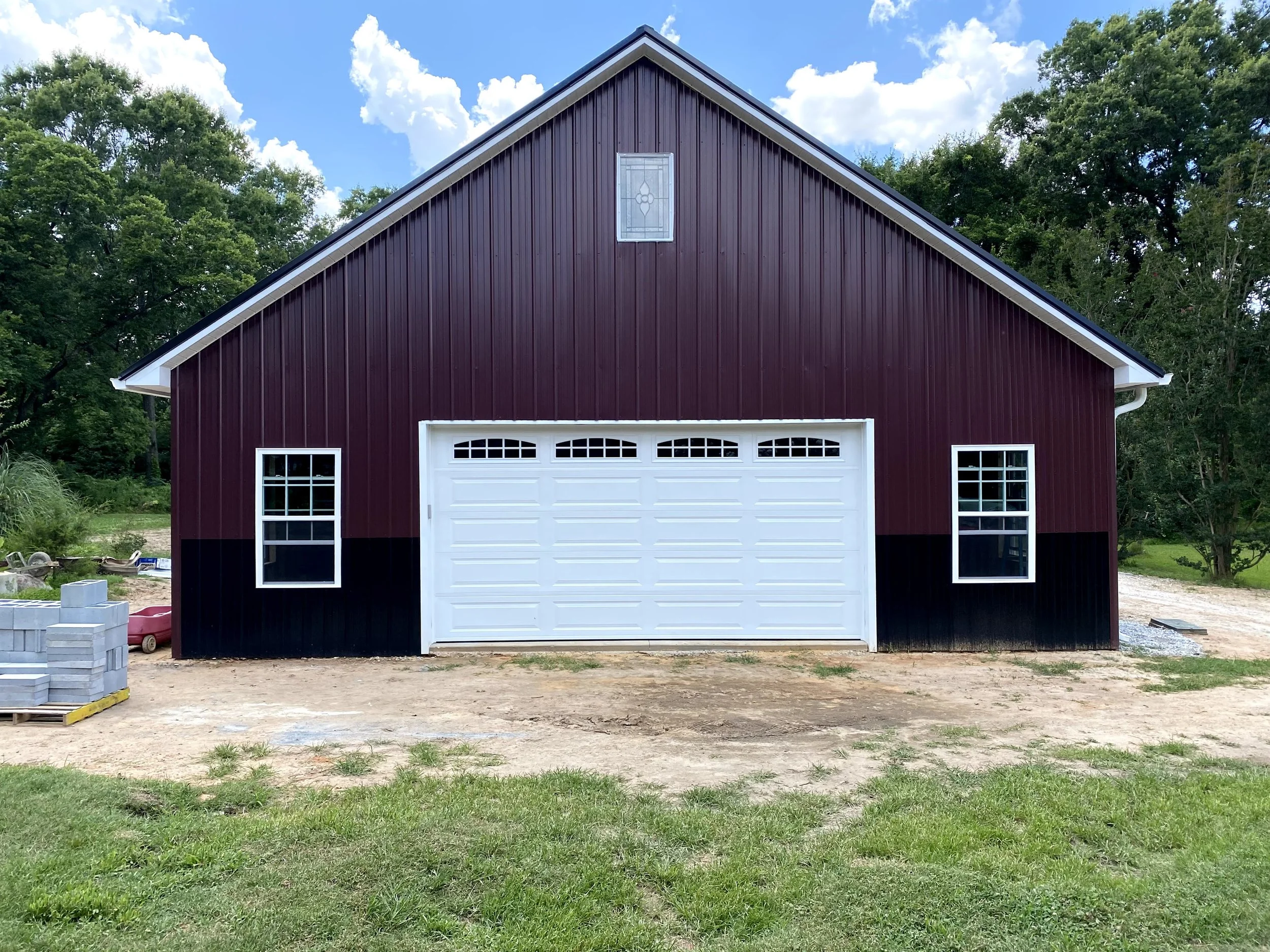 Large pole barn with metal Tough Rib metal roofing and siding. Vinyl windows.