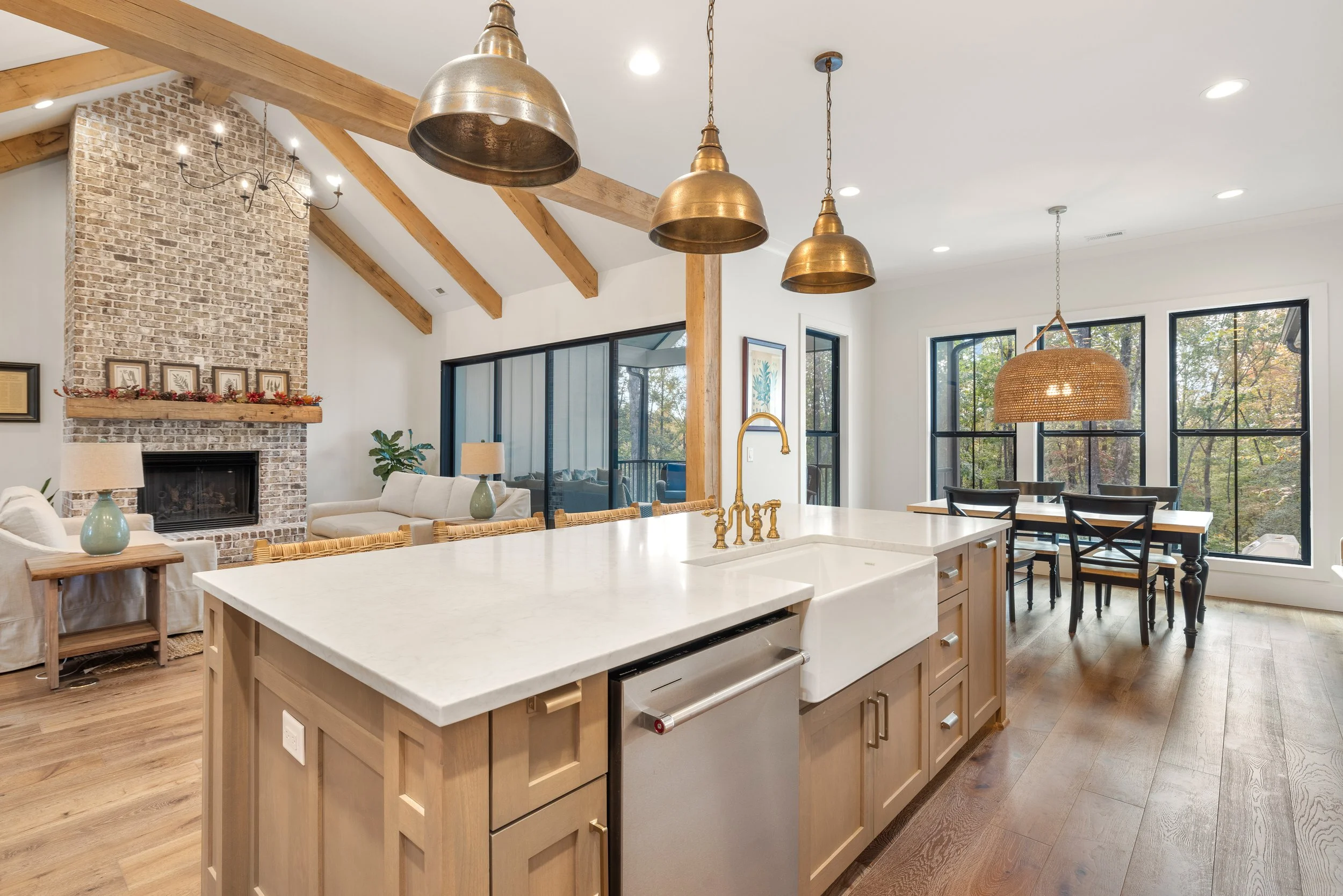 Custom cabinetry. Open kitchen to breakfast area, dining area, and living room. Quartz counters.