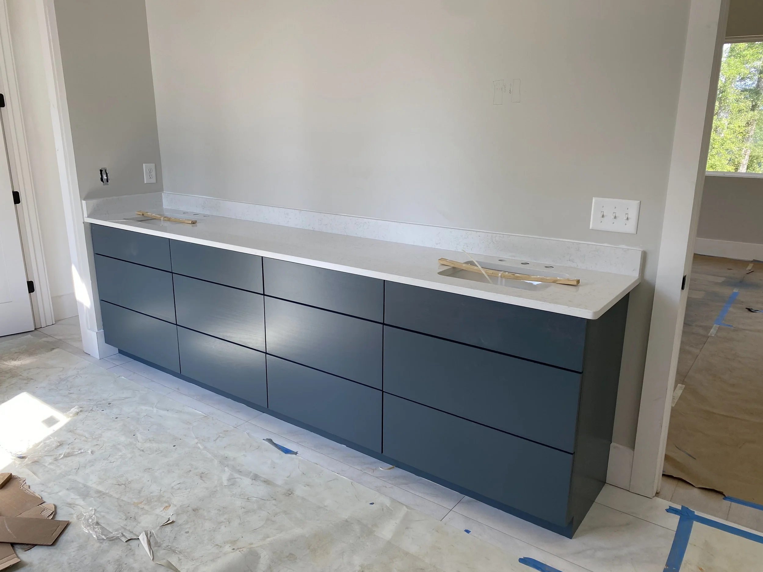 Custom double vanity with Quartz top.
