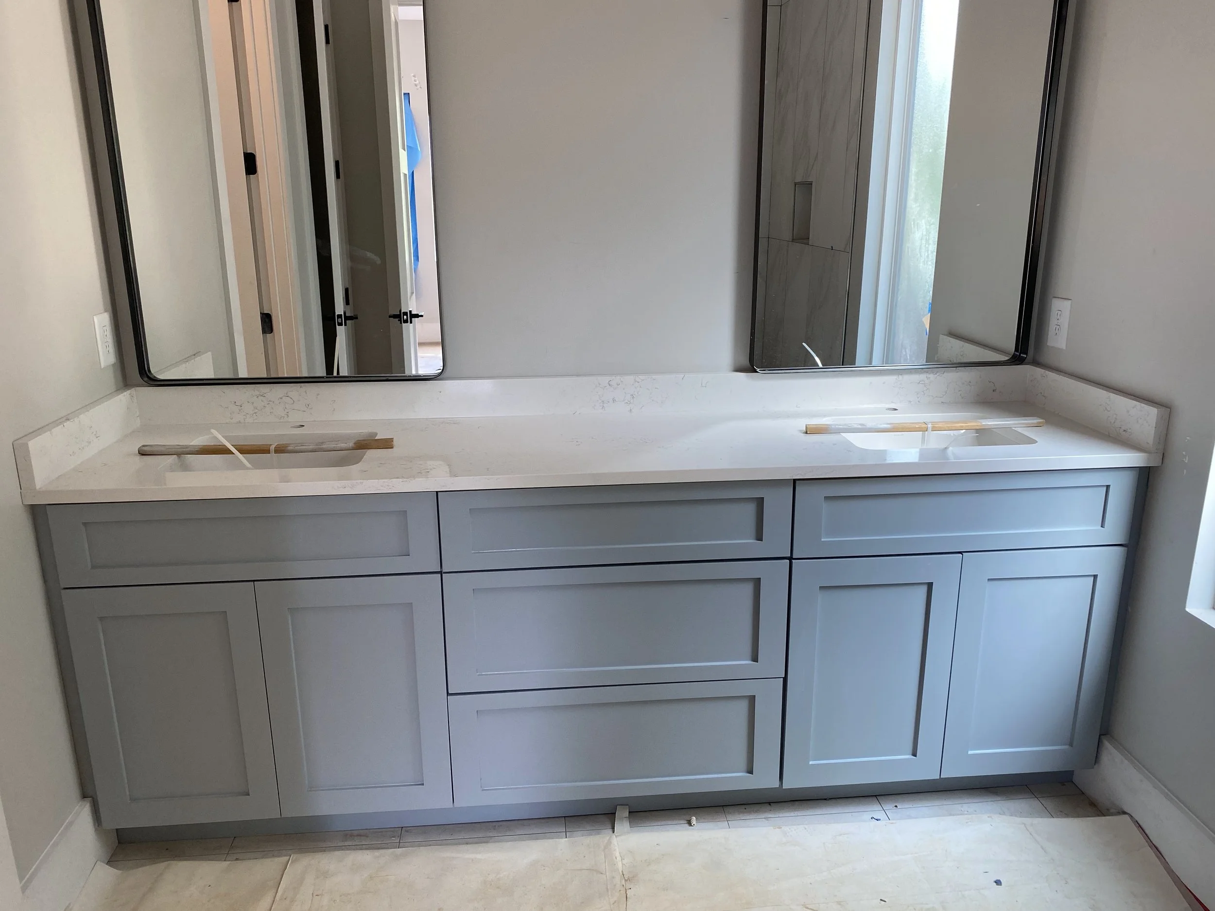 Custom double vanity with Quartz top.