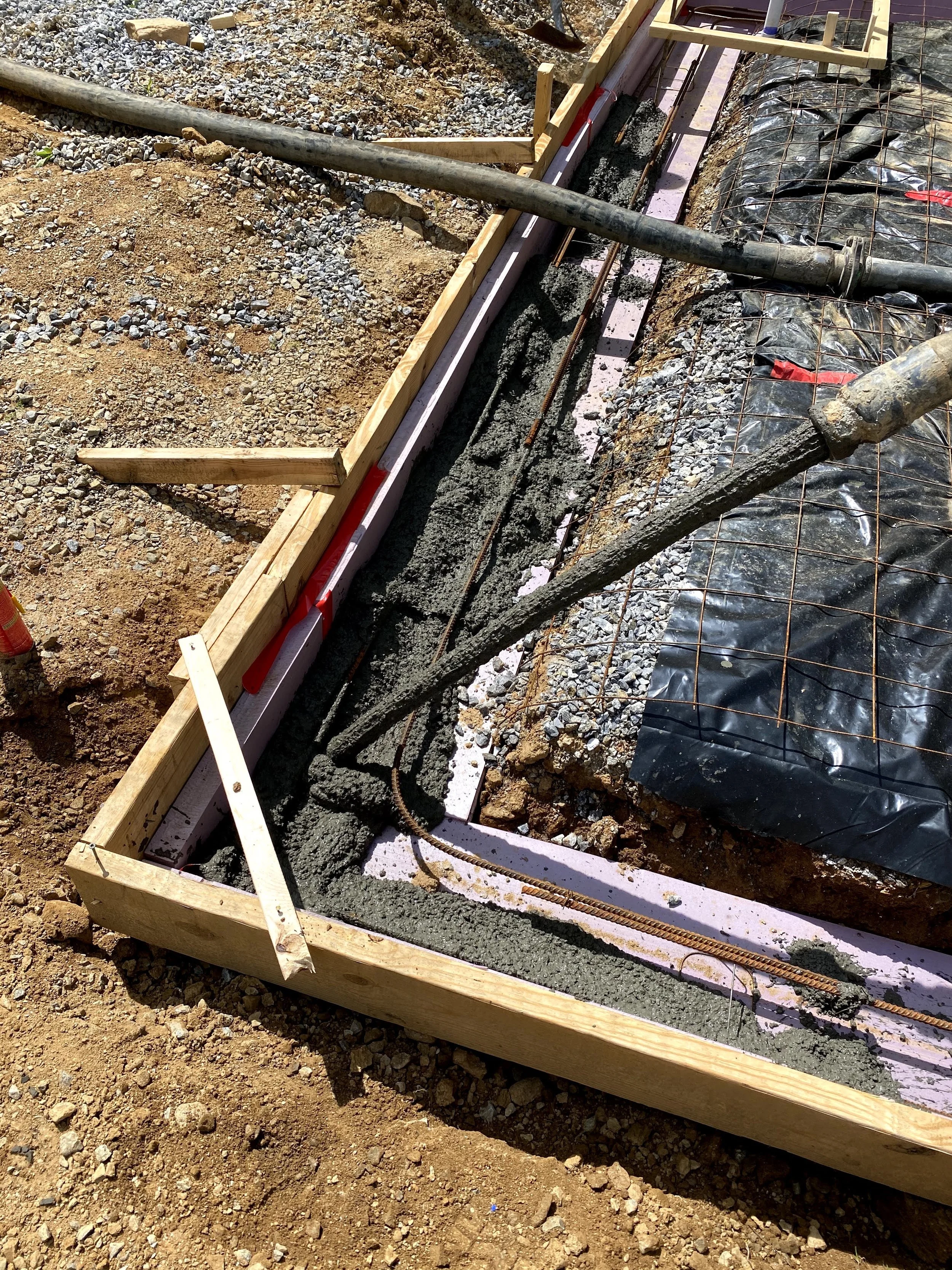 Pouring of concrete via 4" concrete line pump.