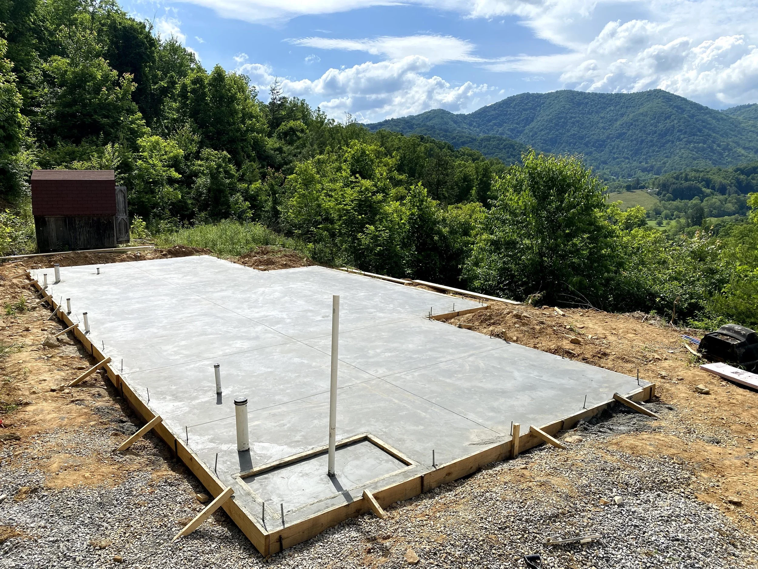 Concrete slab foundation complete. Inset left in slab for walk in shower to create a curbless entry later.