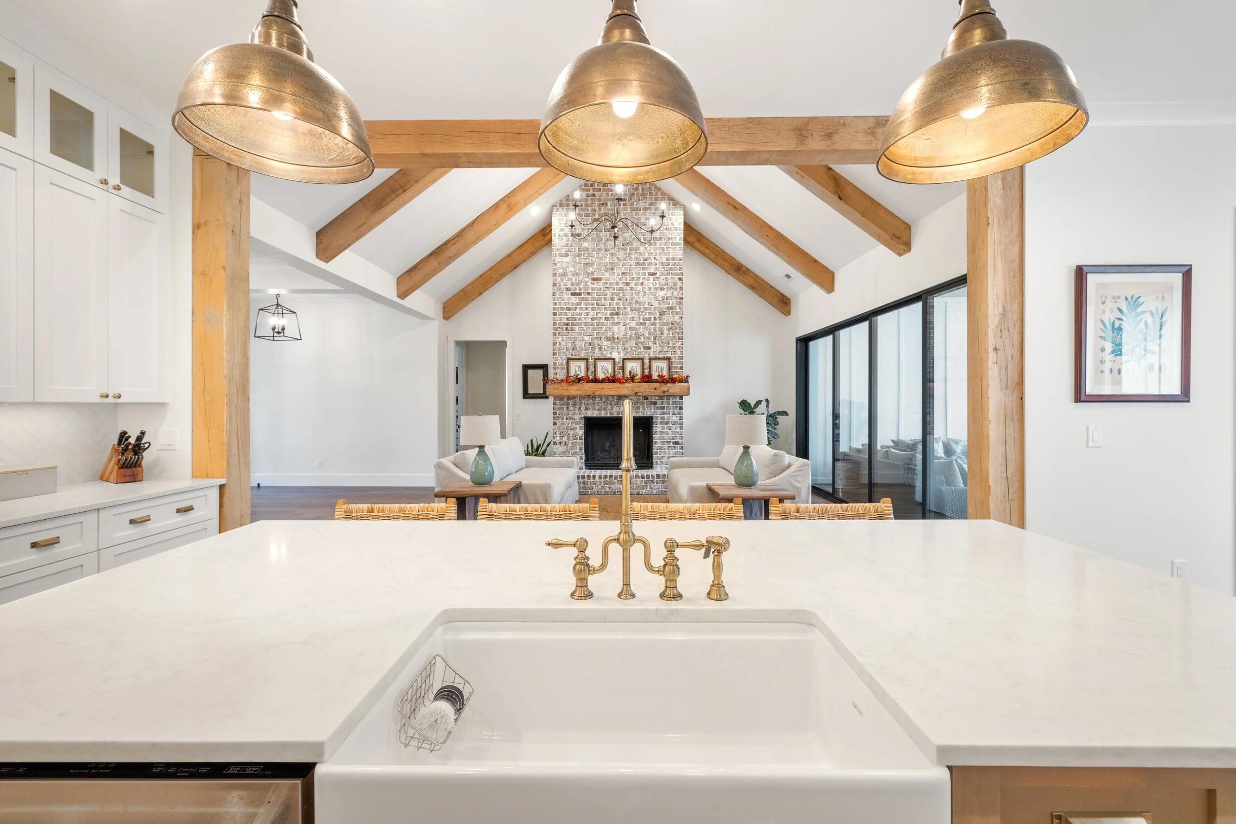 Custom cabinetry. Open kitchen to breakfast area, dining area, and living room. Quartz counters.