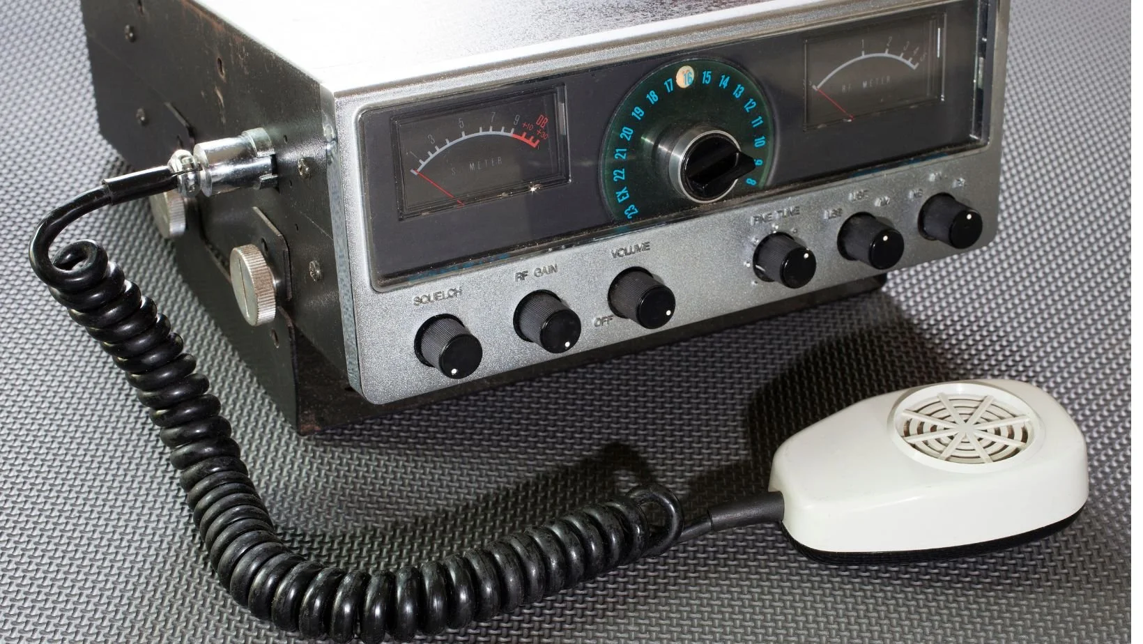 vintage CB radio against a silver backdrop
