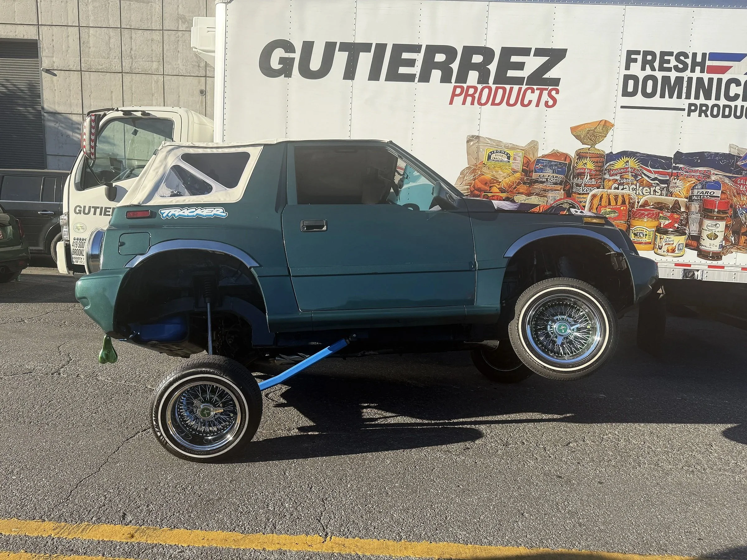 A green Tracker holds a three-wheel stance outside the Brooklyn gathering.