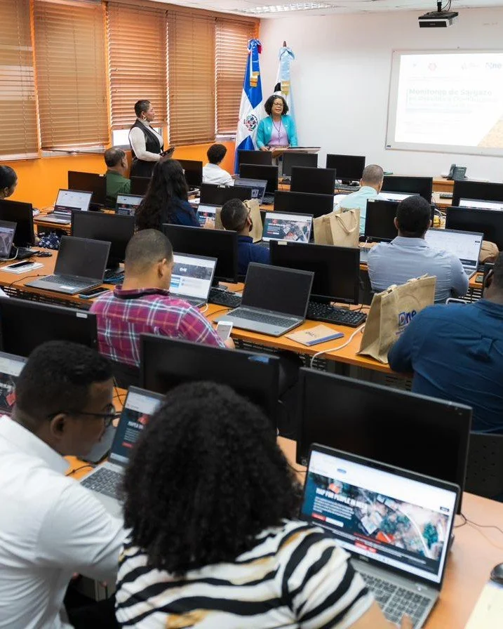 A training room of participants working at computers