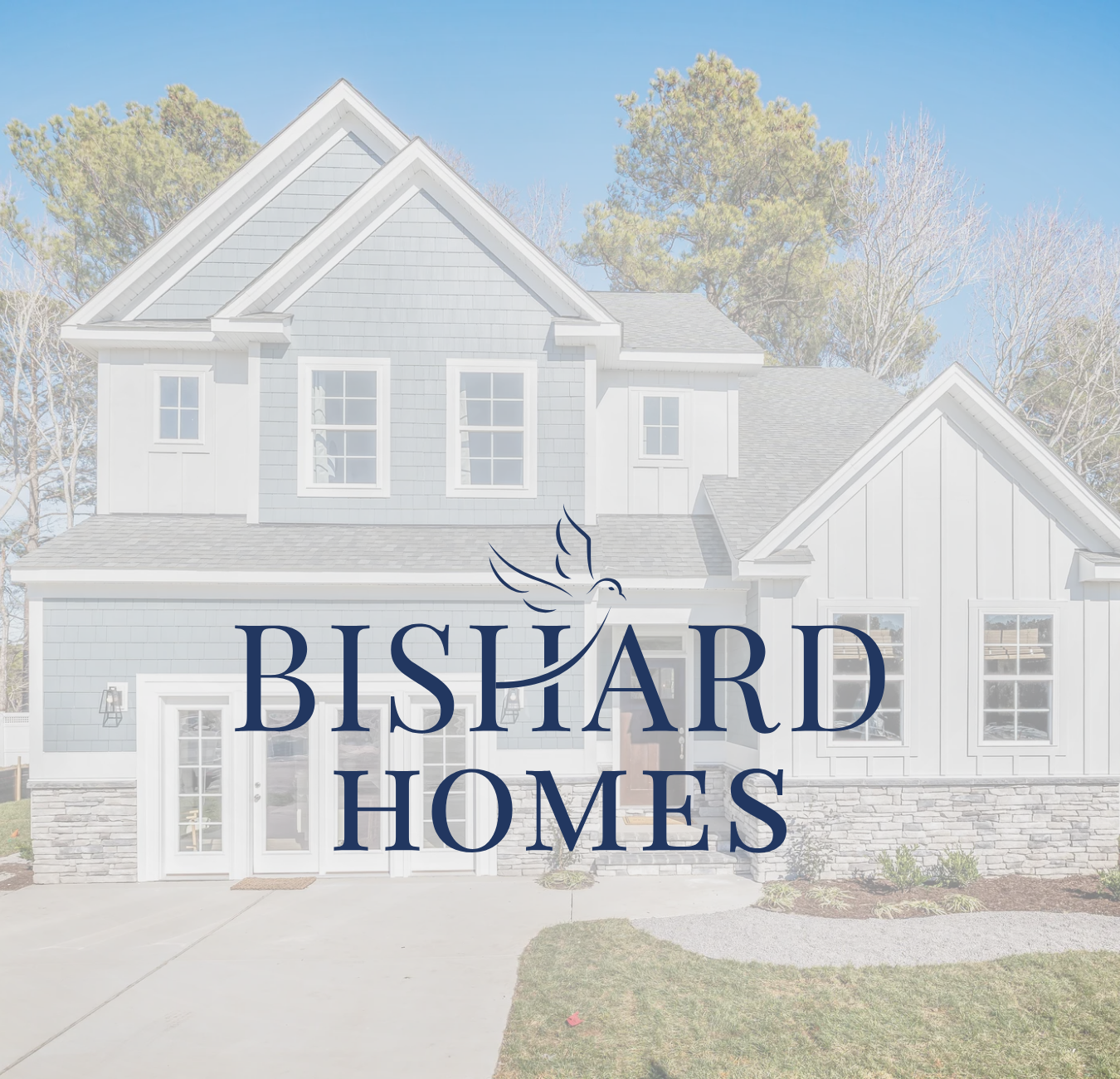Front view of a modern two-story house with gray siding and white trim, with the logo 'Bishard Homes' featuring a stylized bird in flight over the text.