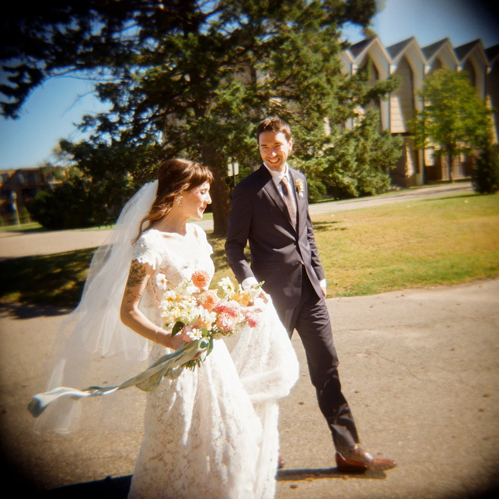 Laurie’s customers, Fernando and Kate embracing by the lake on their wedding day.