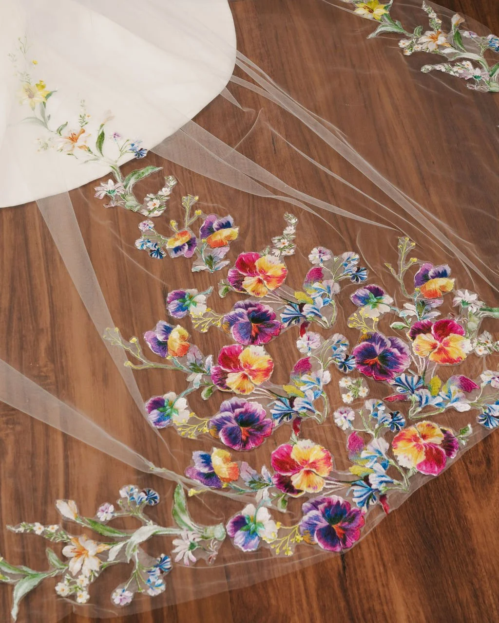 Eyelash embroidery with colorful flowers on a sheer fabric