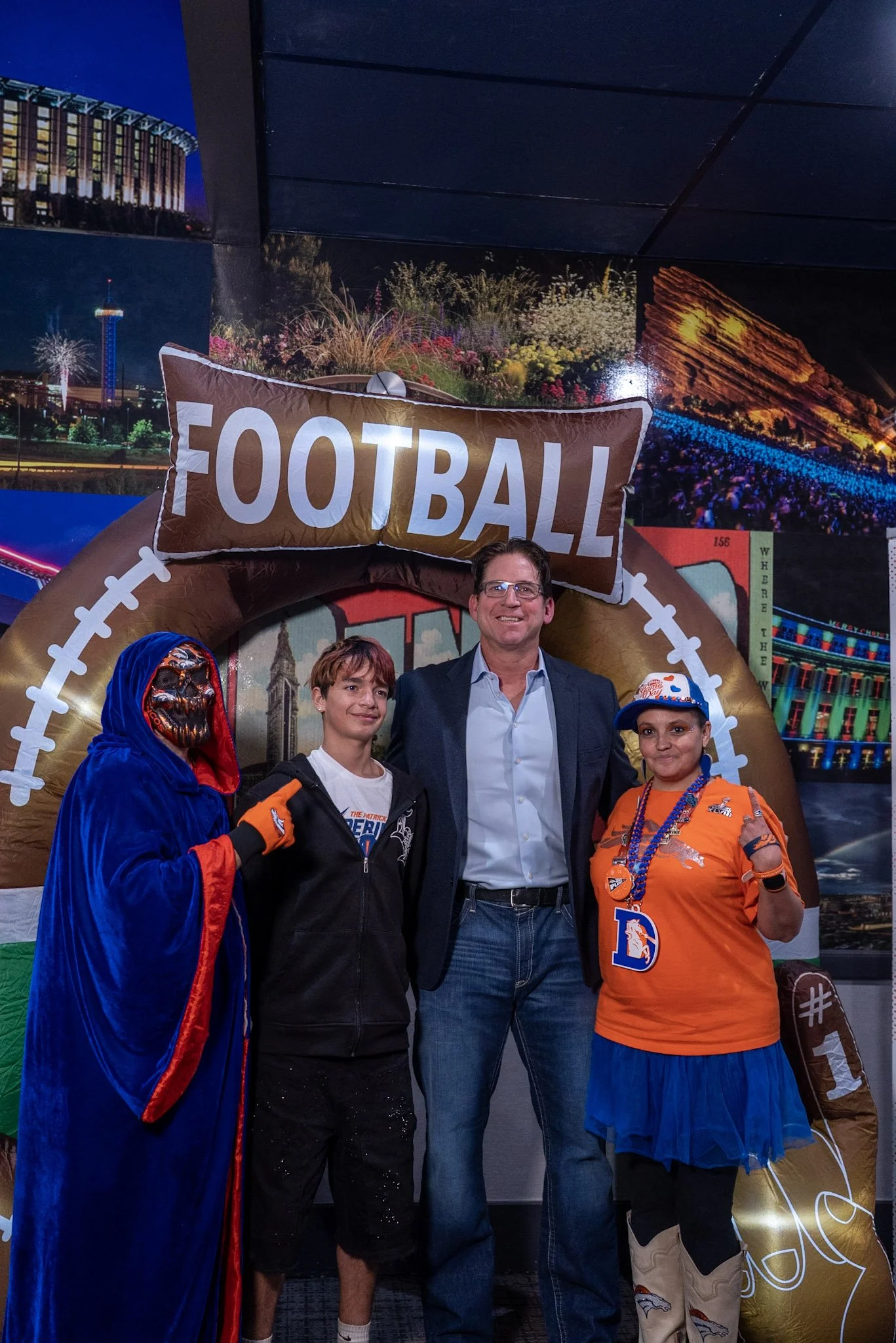 Denver Football Playbook guests take a photo with Ed McCaffrey following the live show.