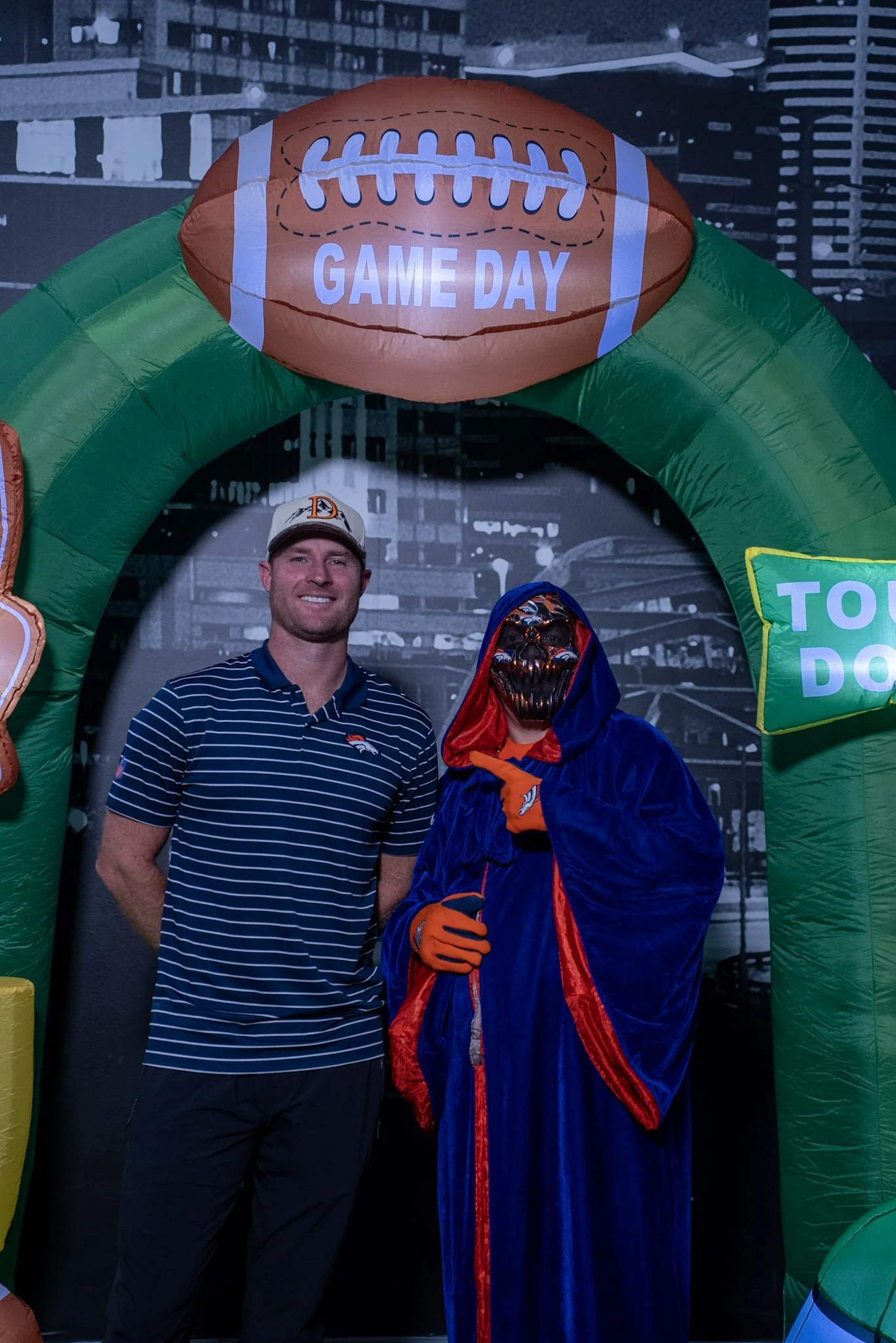 Denver Football Playbook Season 1, Episode 1 guest Wil Lutz poses with a fan at Dave & Buster's in Westminster