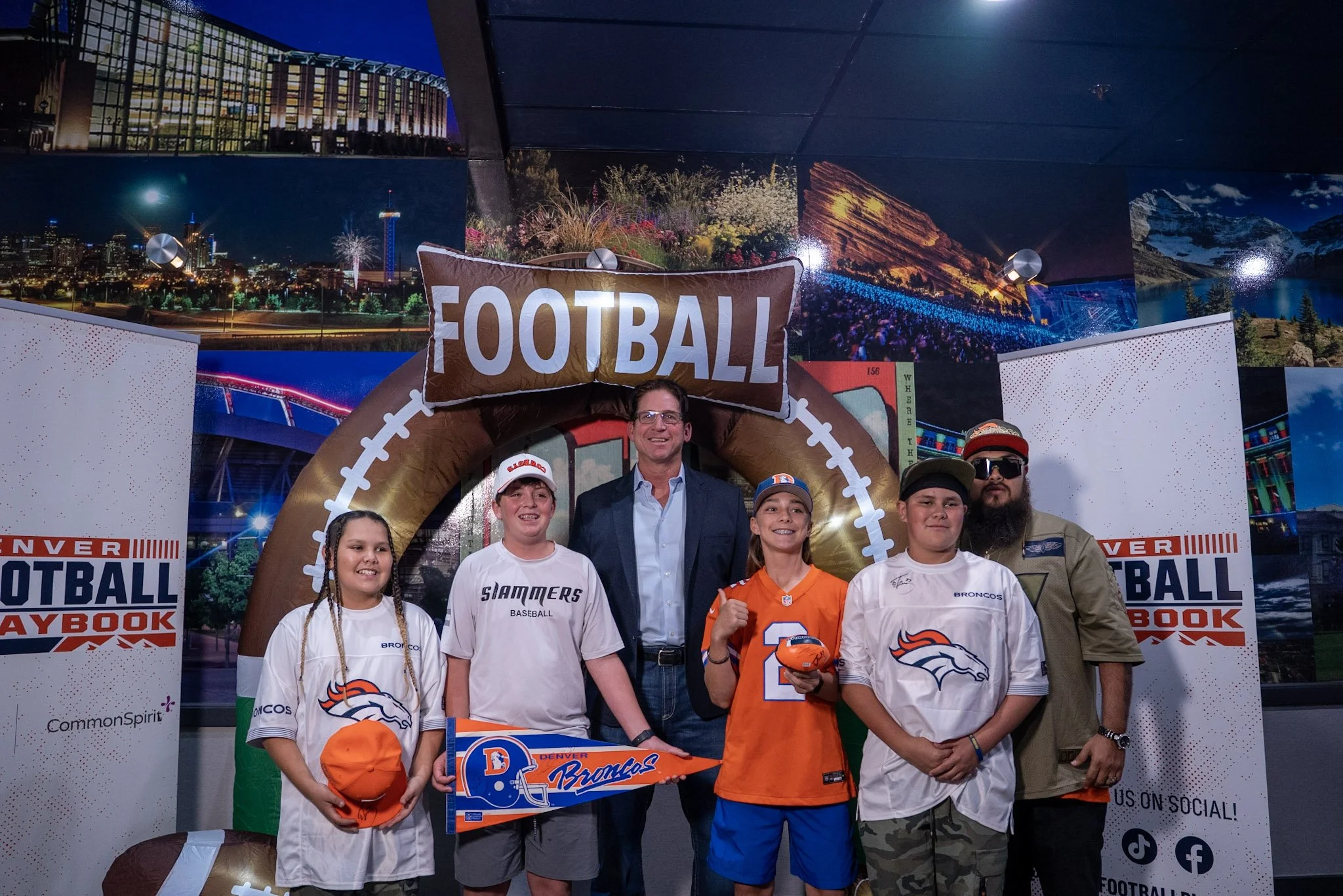 Ed McCaffrey poses with fans during the Denver Football Playbook meet and greet.