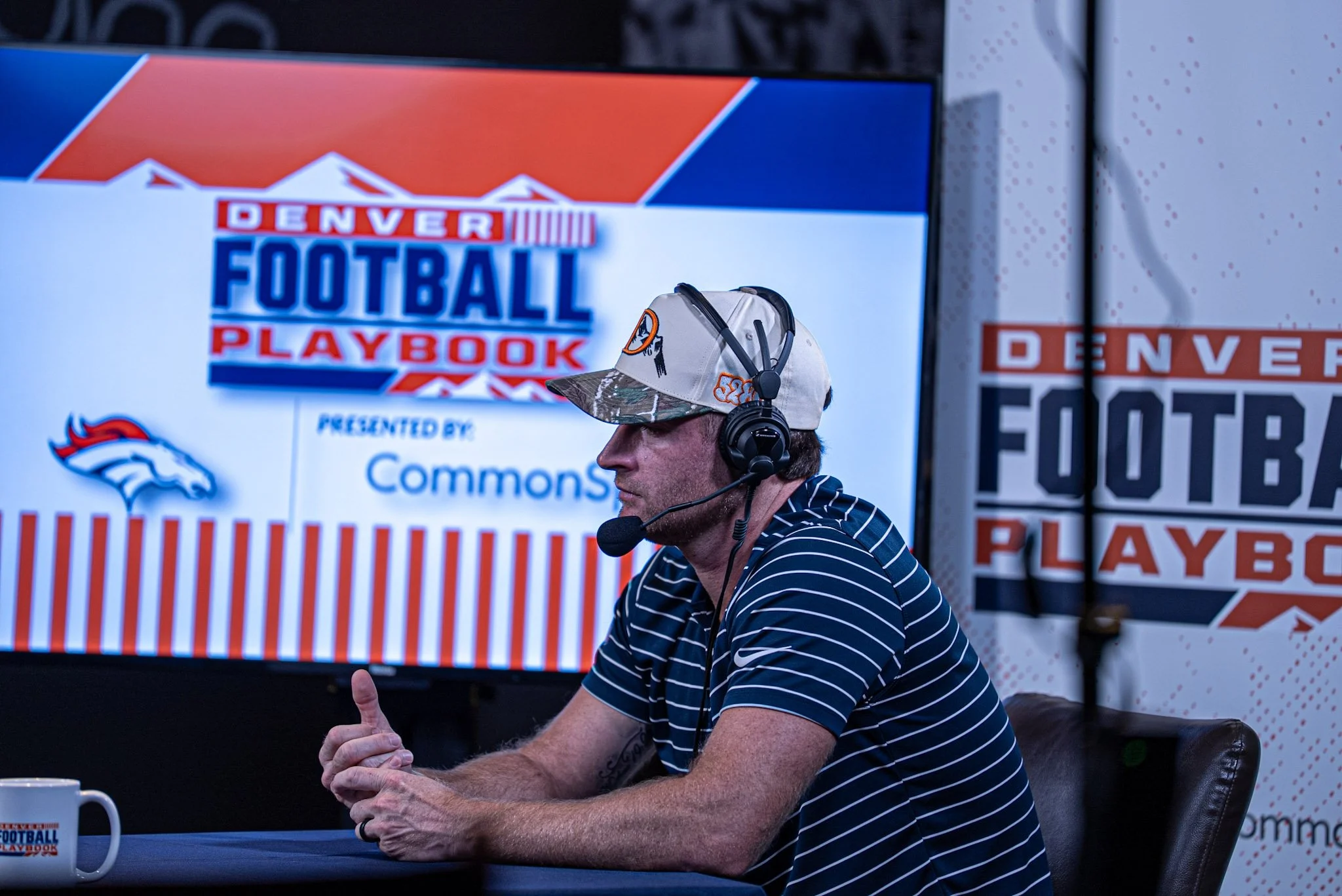 Wil Lutz speaks on stage during the first Denver Football Playbook live show in Westminster, Colorado