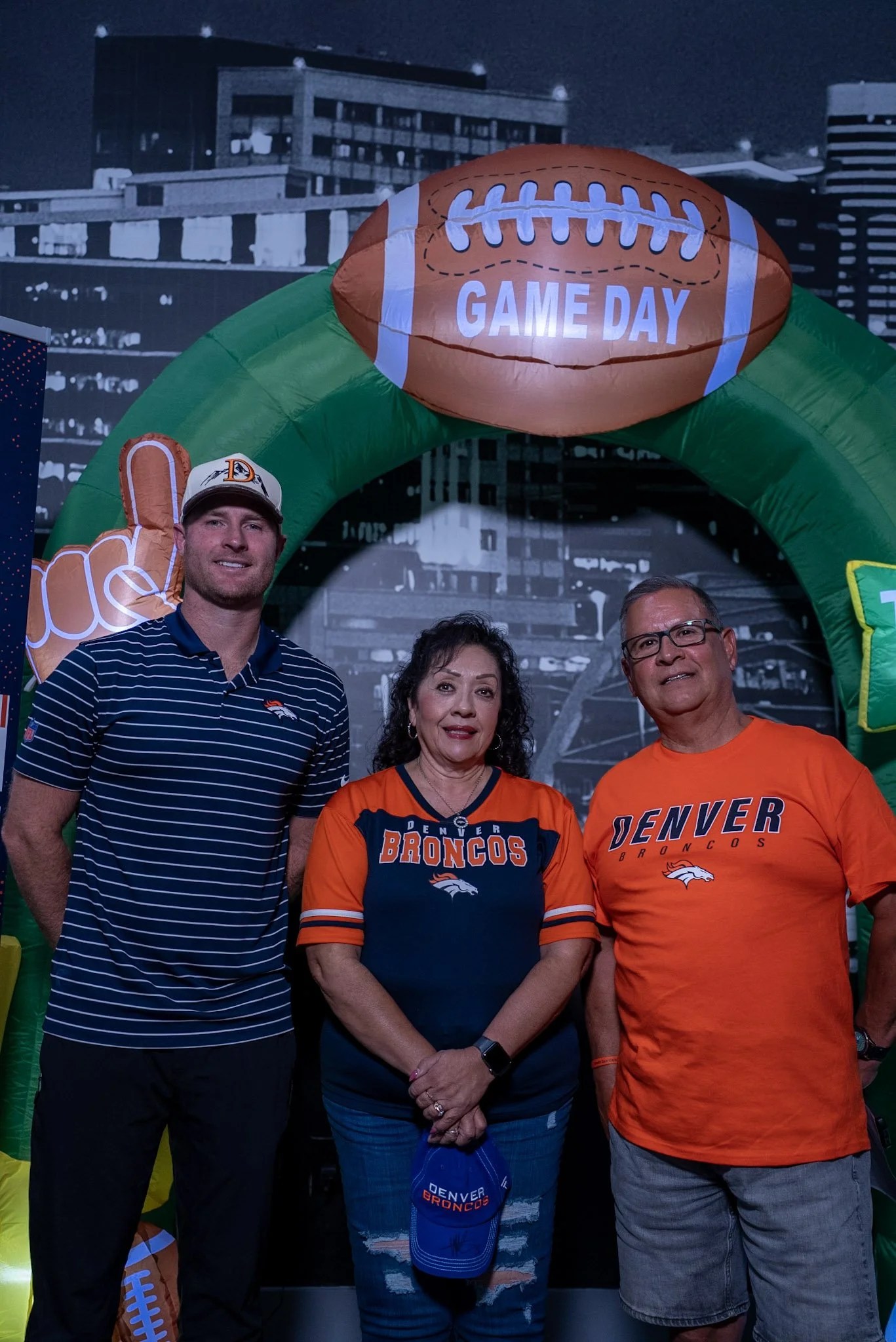 Fans pose with Will Lutz after the Denver Football Playbook live show in Westminster