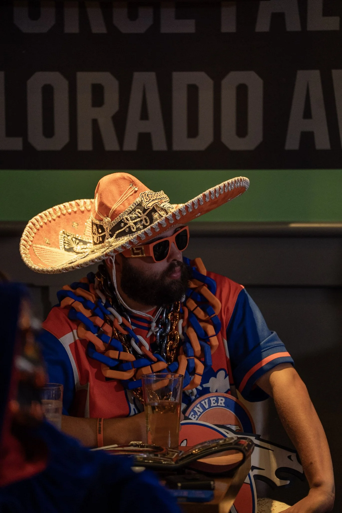 Denver Football Playbook audience member listening to Ed McCaffrey during the live taping.