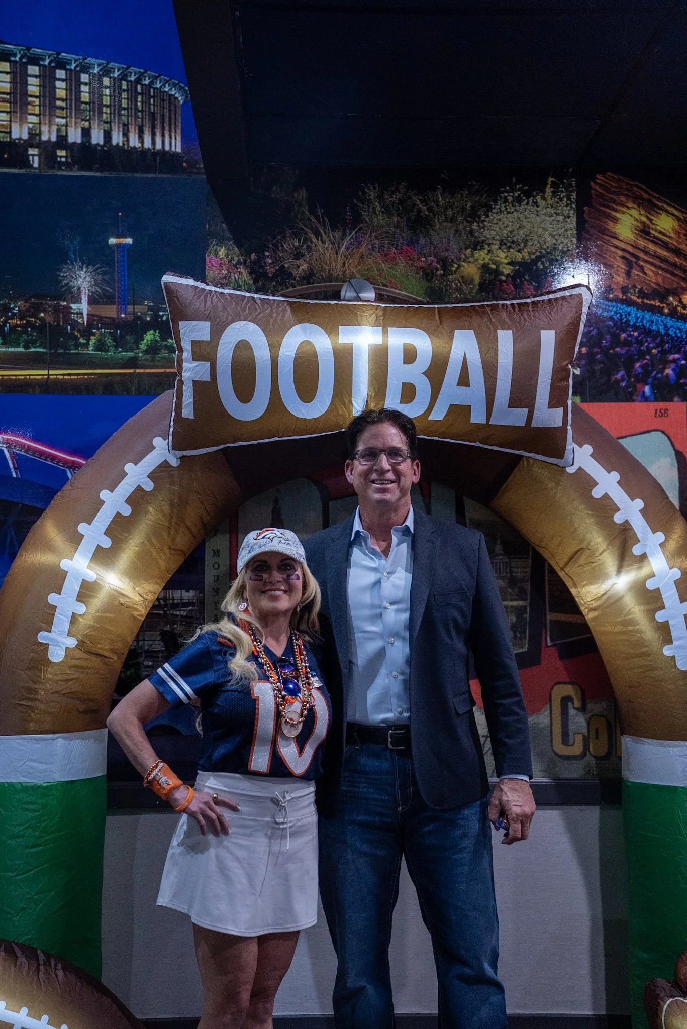 A guest poses with Ed McCaffrey following the Denver Football Playbook live taping.