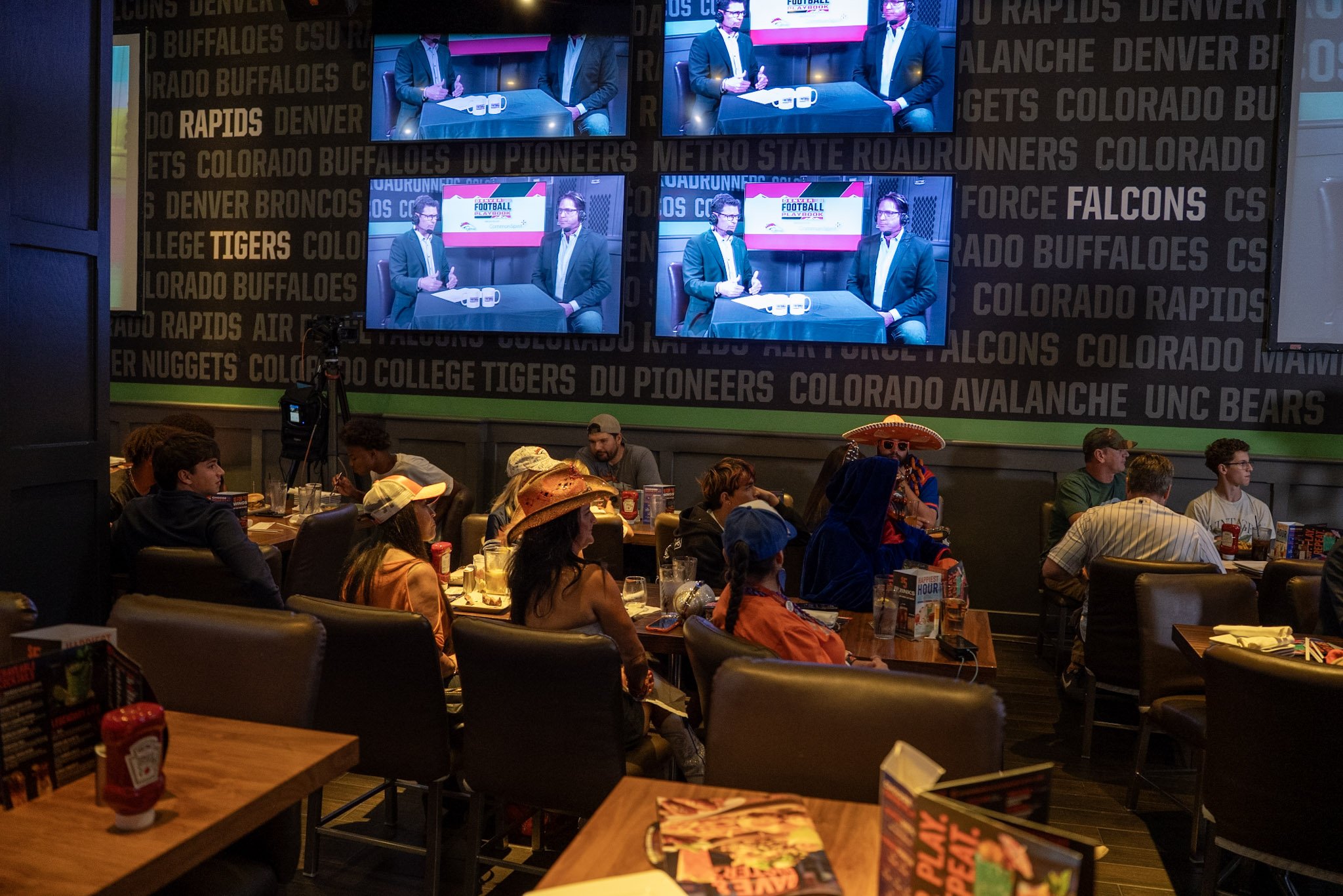 Denver fans attend a live taping of Denver Football Playbook at Dave & Buster’s Denver.
