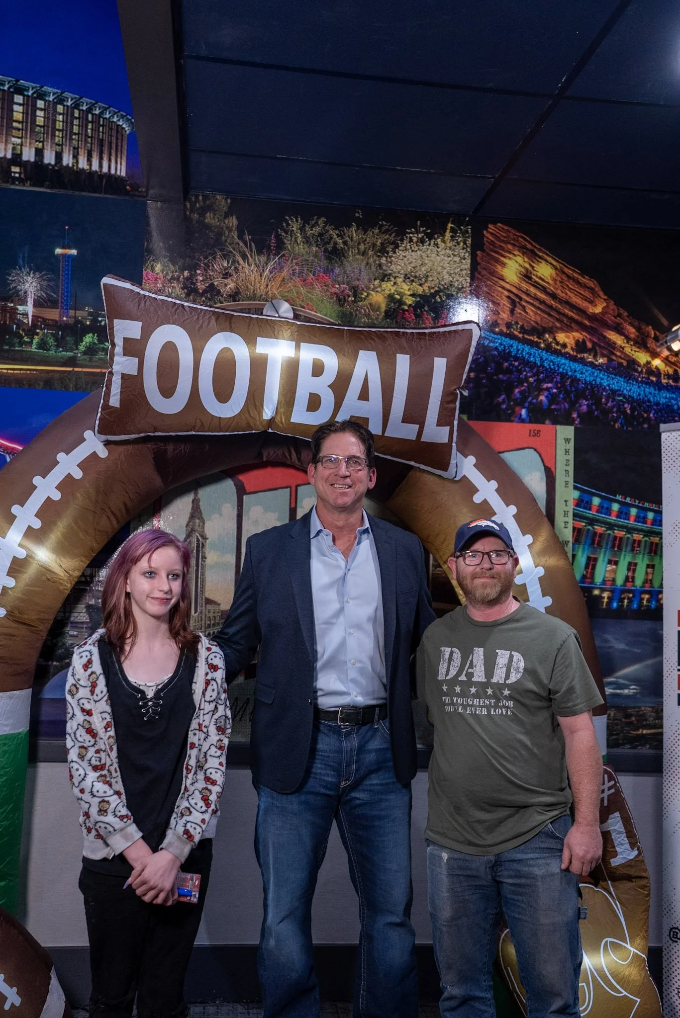 Ed McCaffrey meets with two guests after Denver Football Playbook LIVE at Dave & Buster’s Denver.