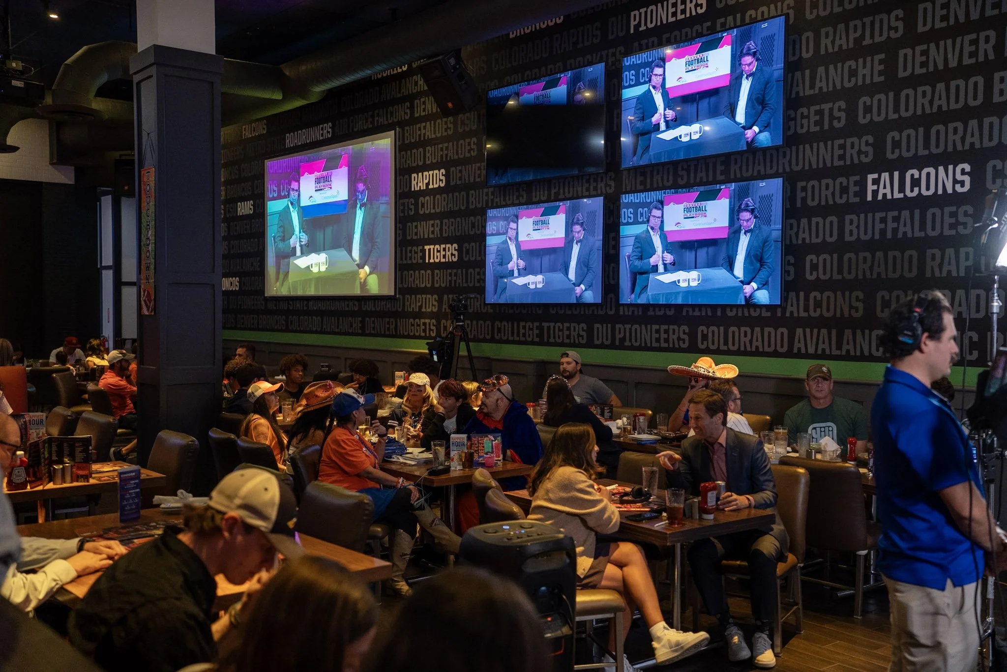 A packed crowd watches Ed McCaffrey during Denver Football Playbook LIVE.