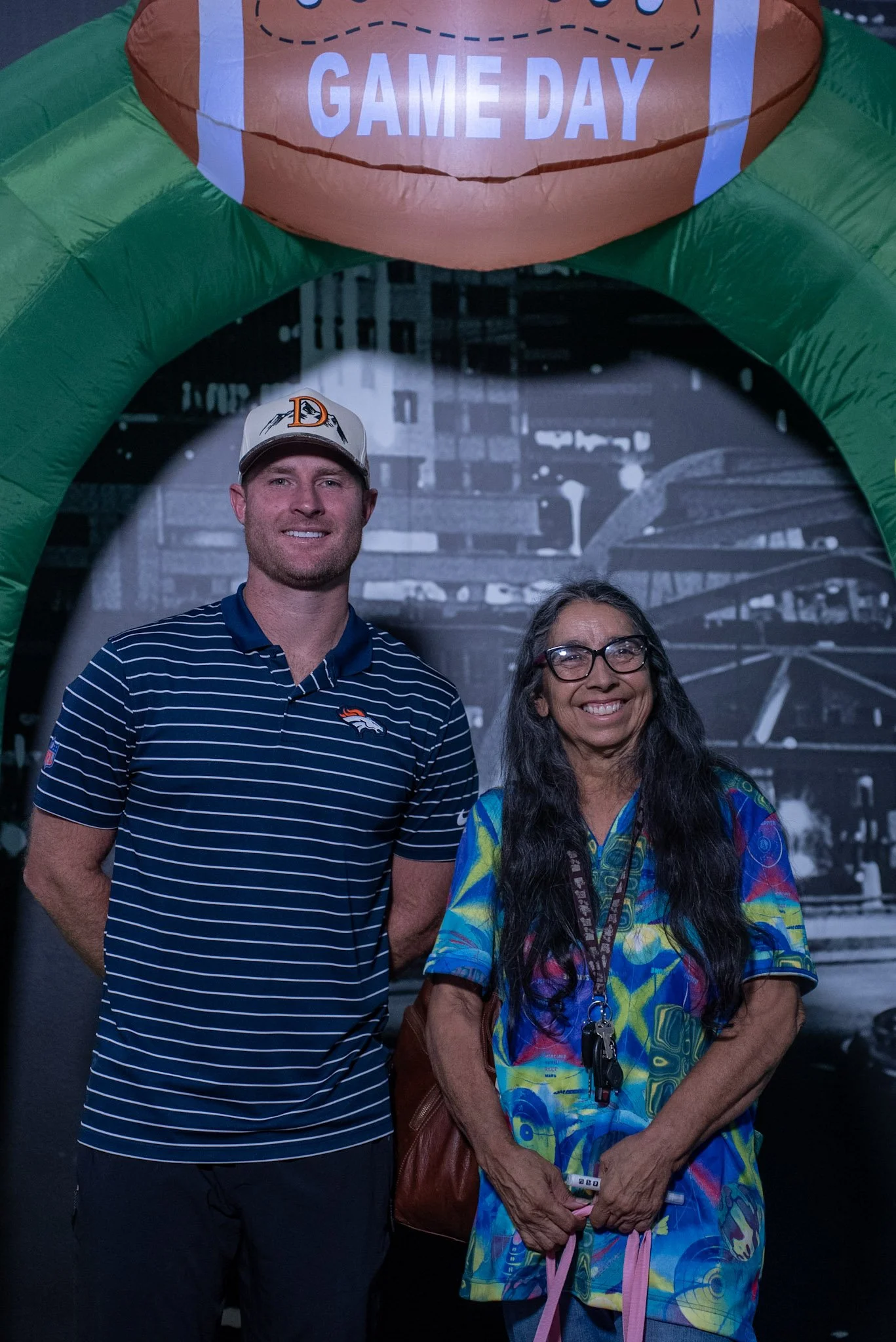 Denver Football Playbook guest Wil Lutz poses with a fan at Dave & Buster's in Westminster