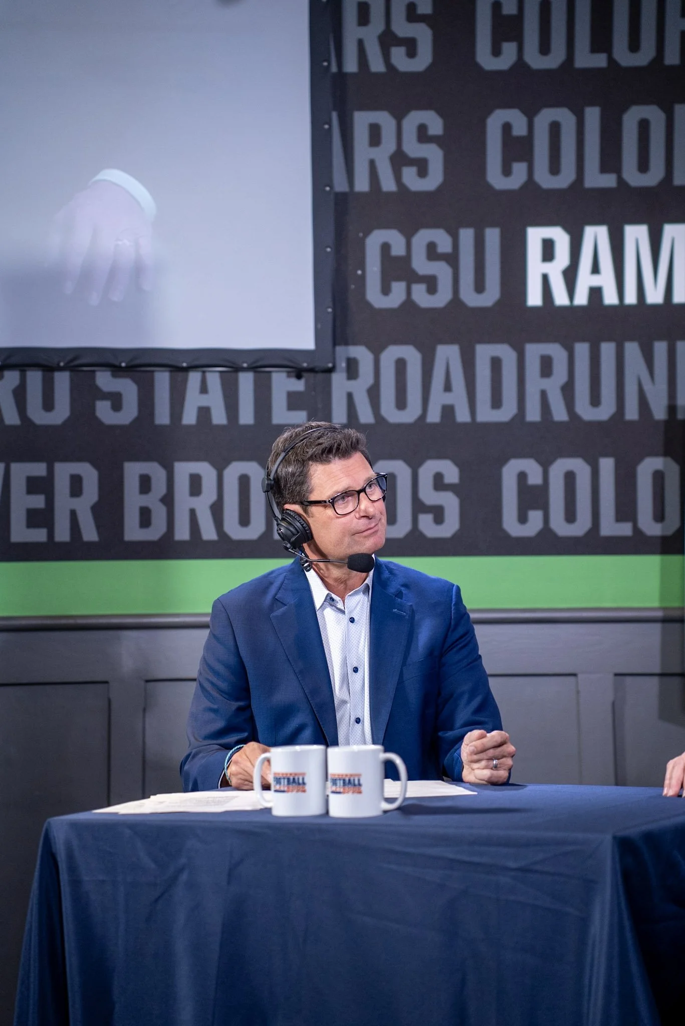 Arran Andersen asks Ed McCaffrey a question during a live taping of Denver Football Playbook at Dave & Buster’s Denver.