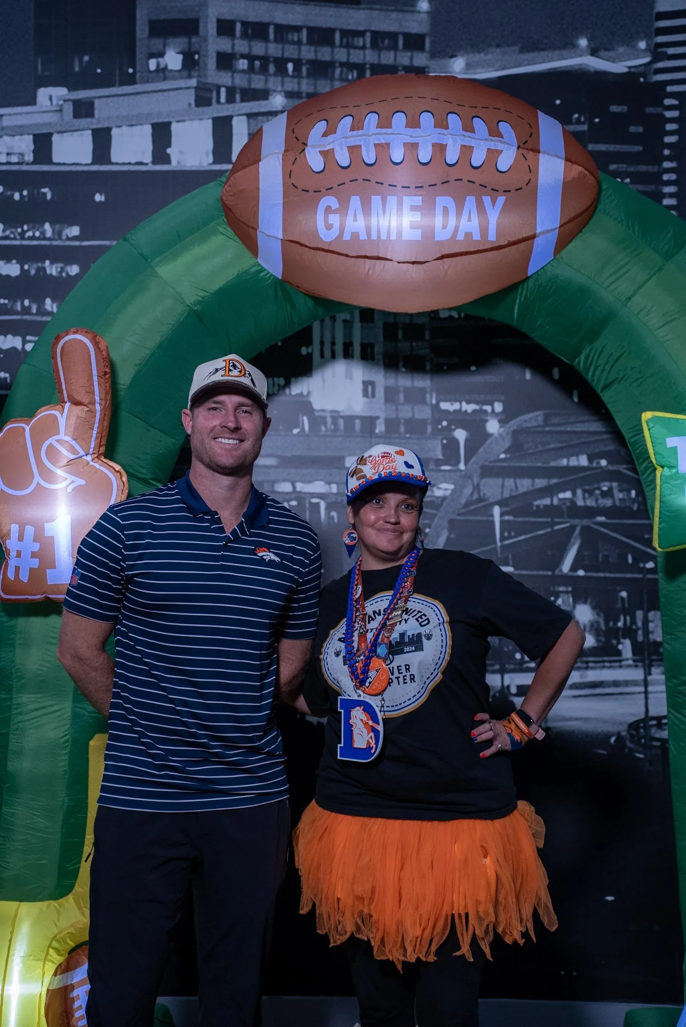 Denver Football Playbook Season 1, Episode 1 guest Wil Lutz poses with a fan at Dave & Buster's in Westminster