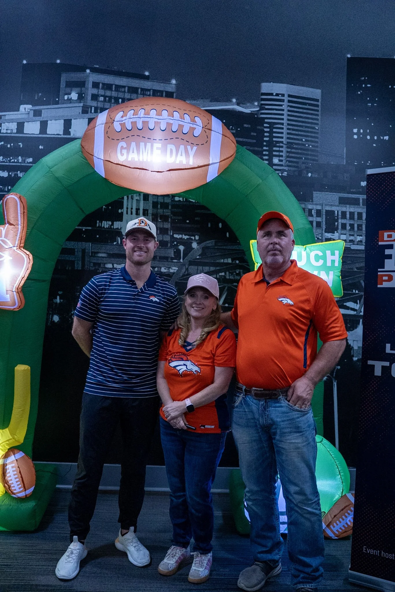  Will Lutz takes a photo with two fans after the Denver Football Playbook live show in Westminster, Colorado