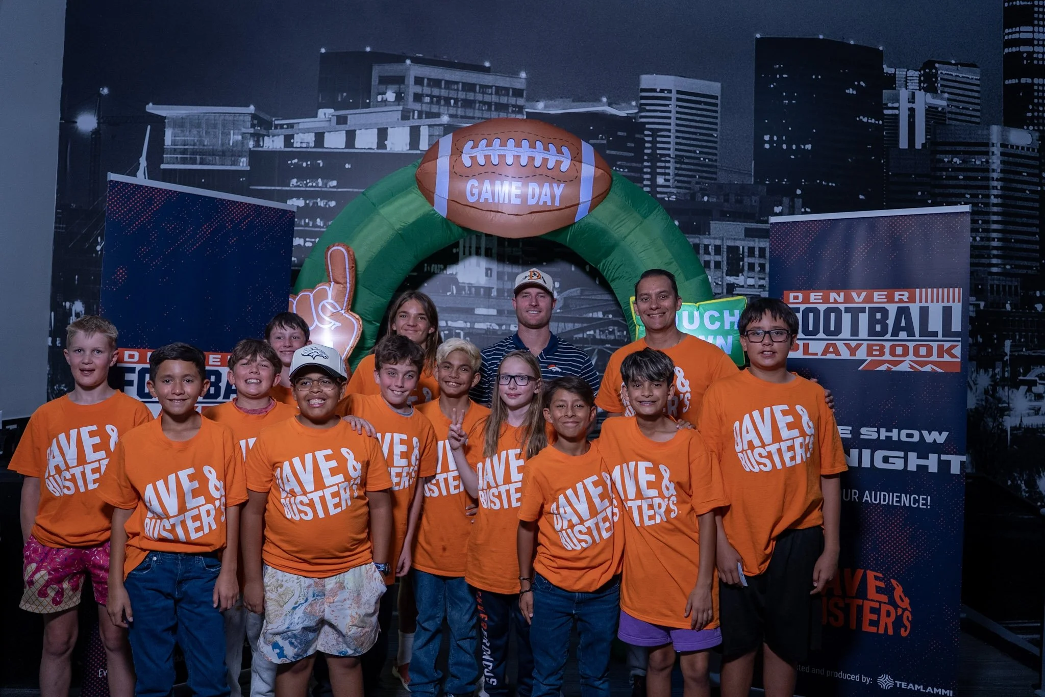 Denver Football Playbook Season 1 Episode 1 Wil Lutz and a group of kids at the live show in Westminster