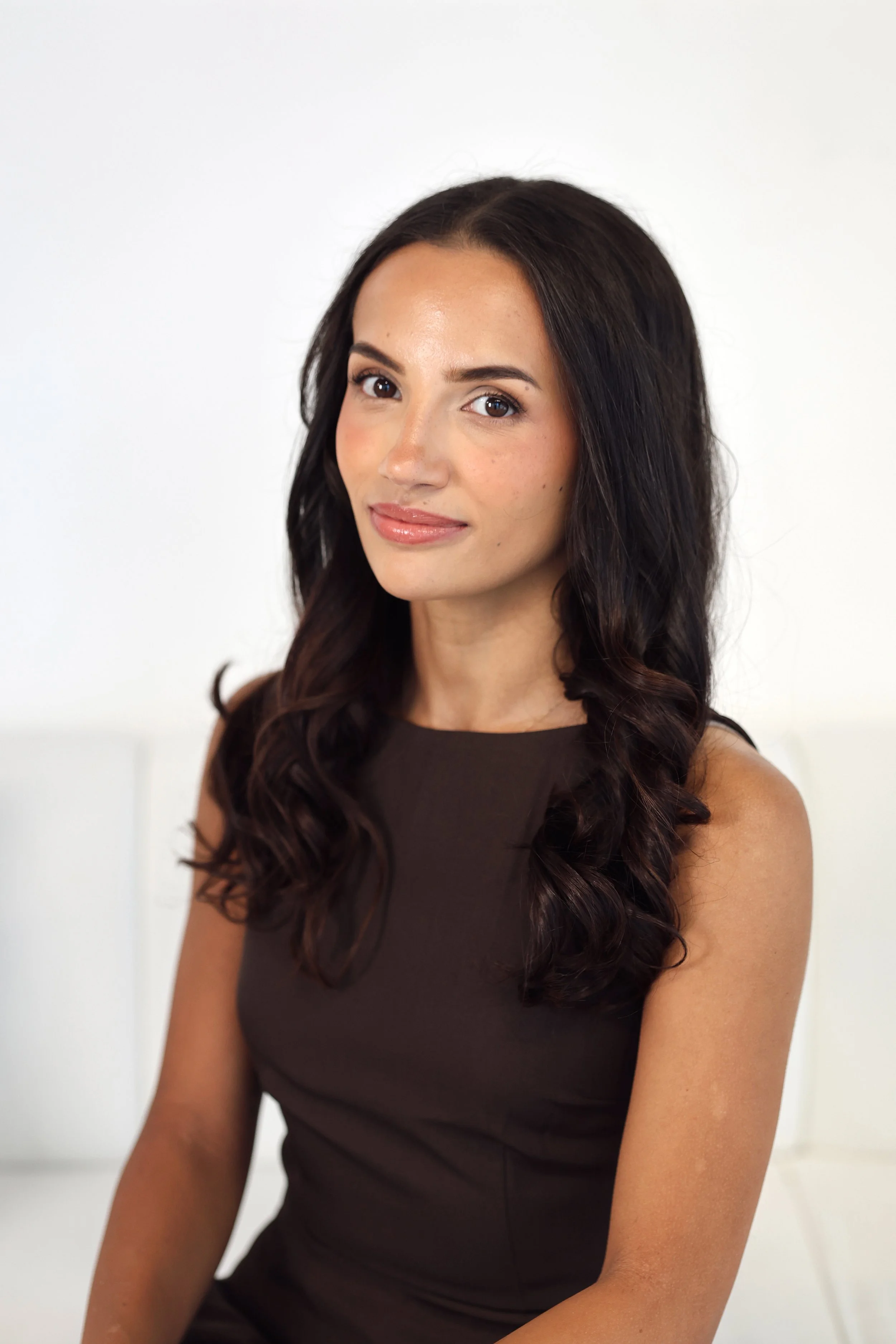 Close-up portrait of Summer in a dark brown sleeveless top