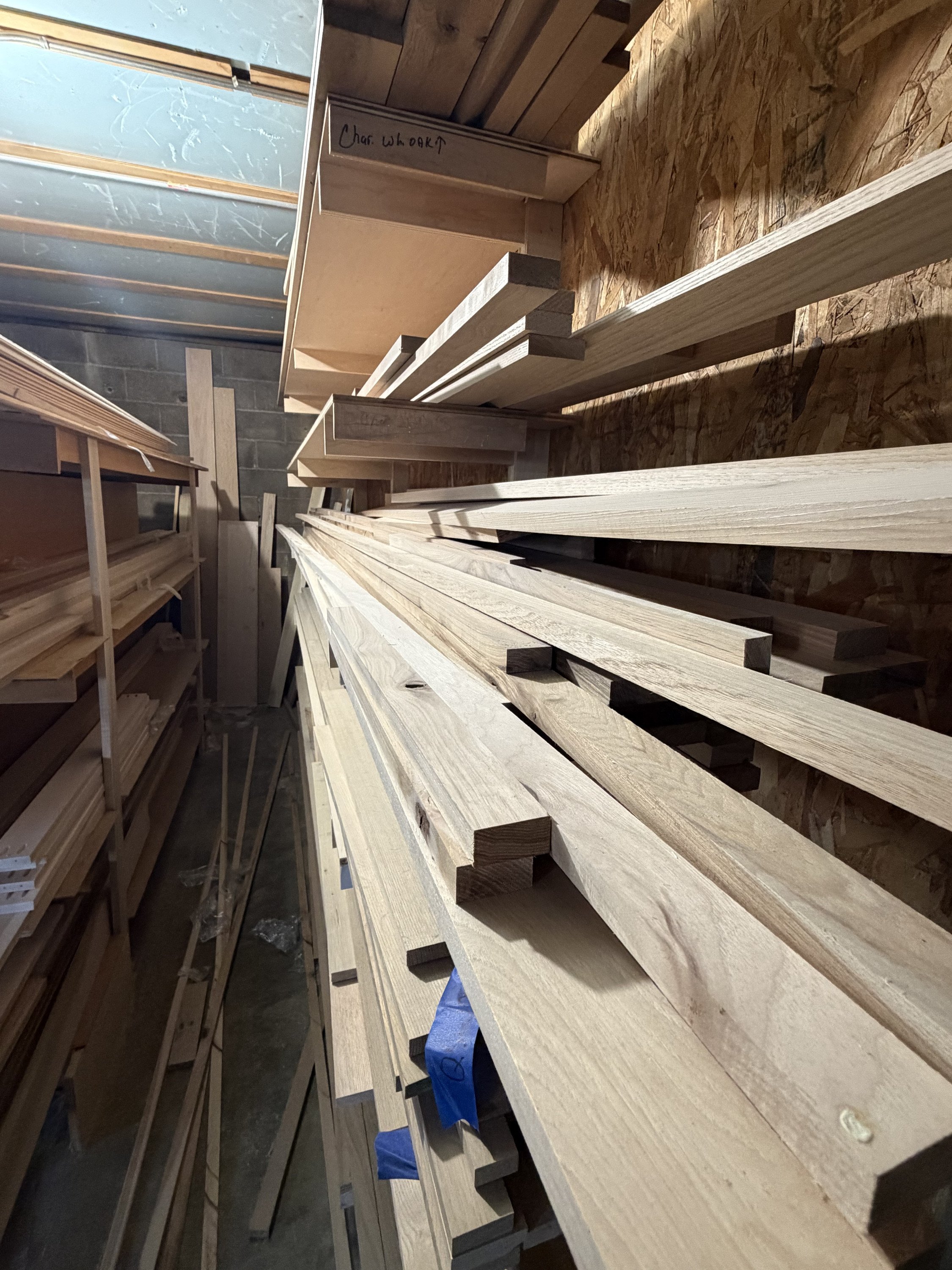 Rack of hardwood maple stock in the workshop
