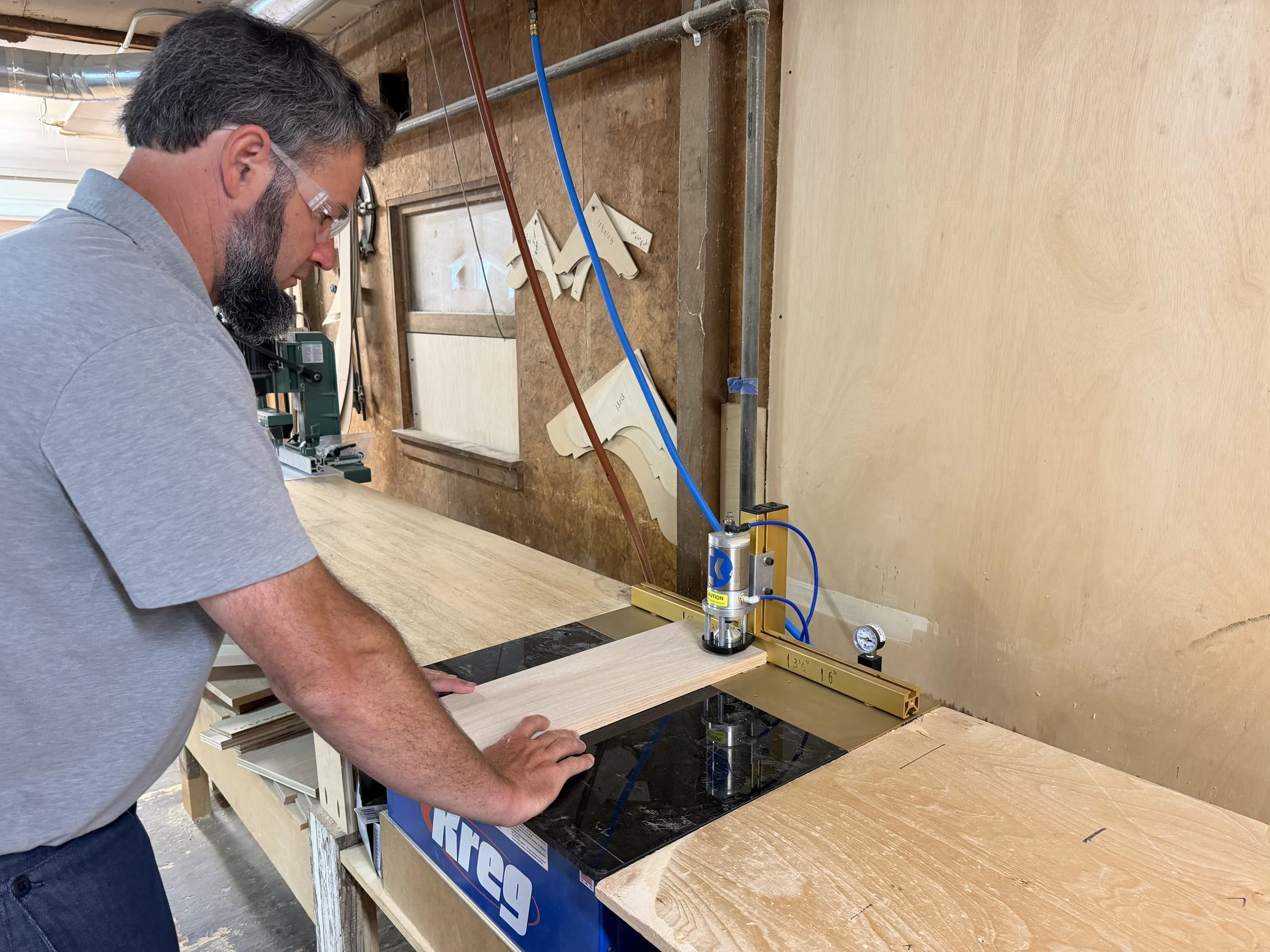 Cabinet frame being joined with a pocket-hole jig in the workshop
