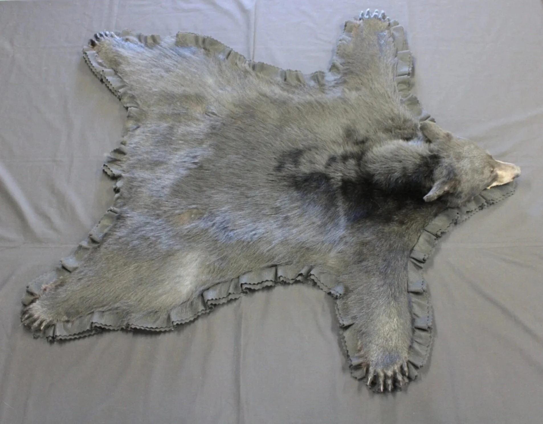 Standard bear rug with dark felt. 