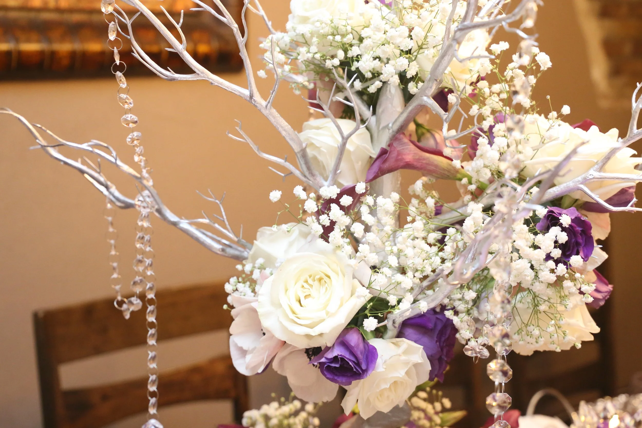 purple and white flower centerpiece