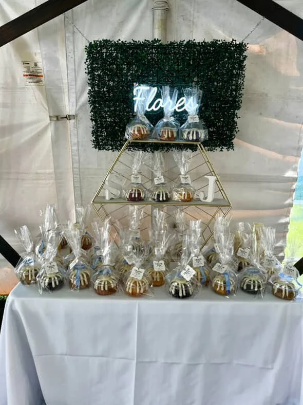 party favor table with individually wrapped cakes.JPG