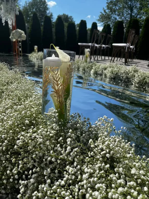 wedding ceremony aisle decorated with flowers.JPG