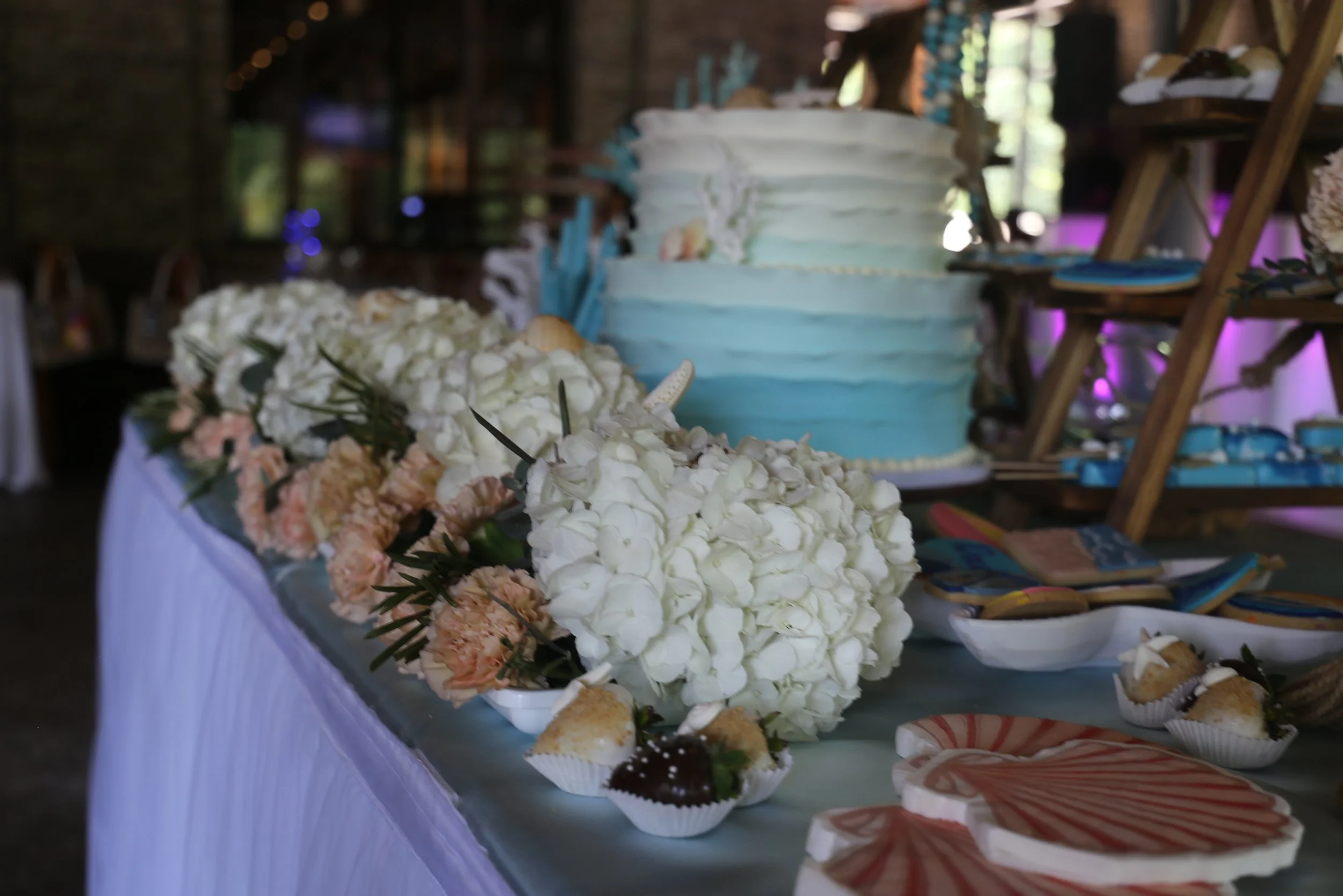cake table with blue and white ombre cake.JPG