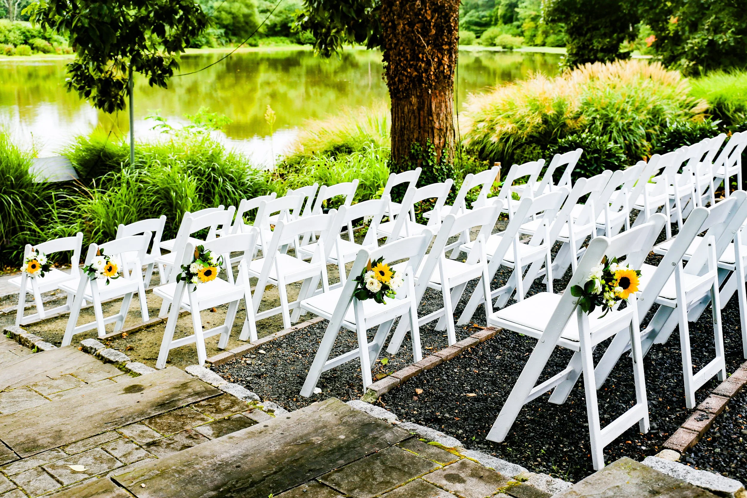 white chairs at wedding ceremony.JPG