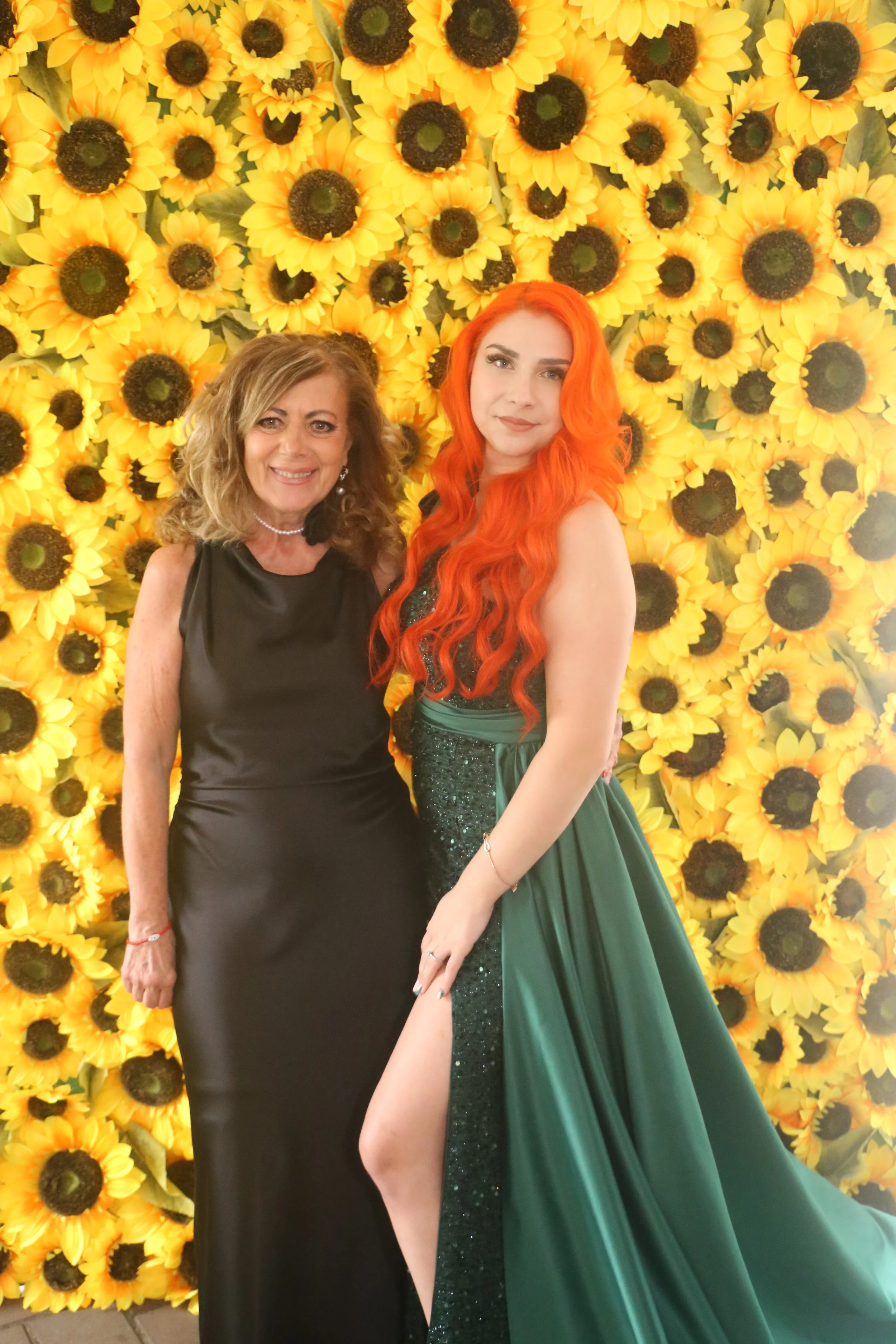 clara with client and sunflower wall.JPG