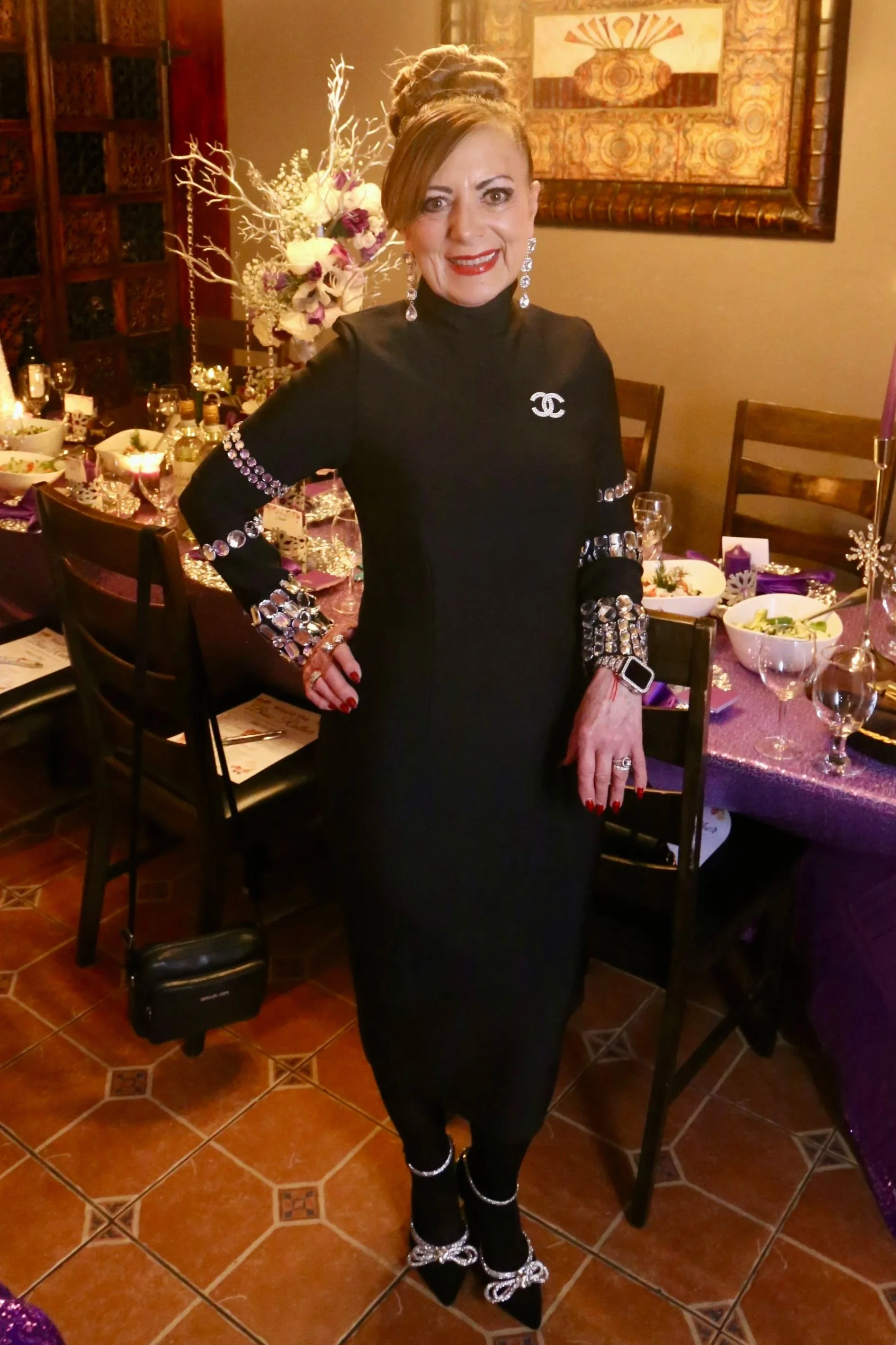 owner of clara creations in black outfit