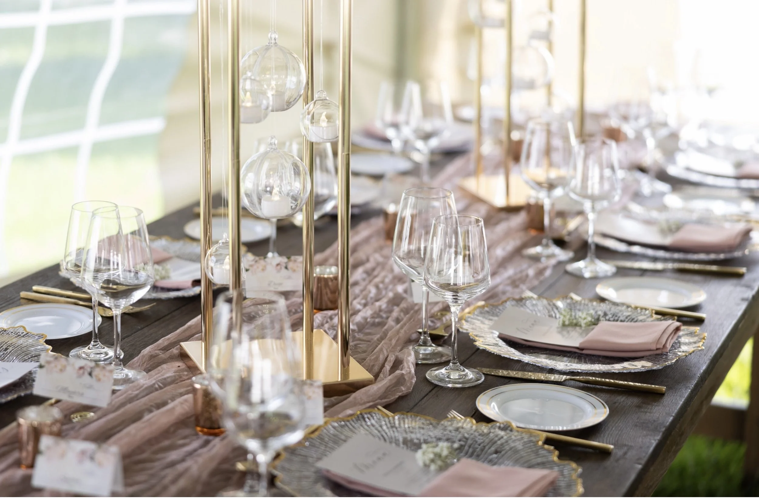 pink and gold table setting at an event.jpg