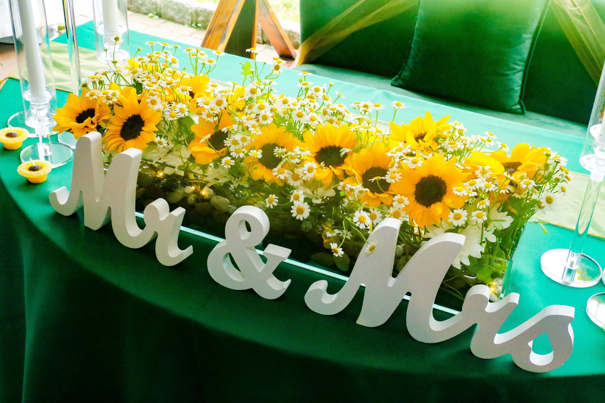 mr and mrs sign with sunflowers and green tablecloth.JPG