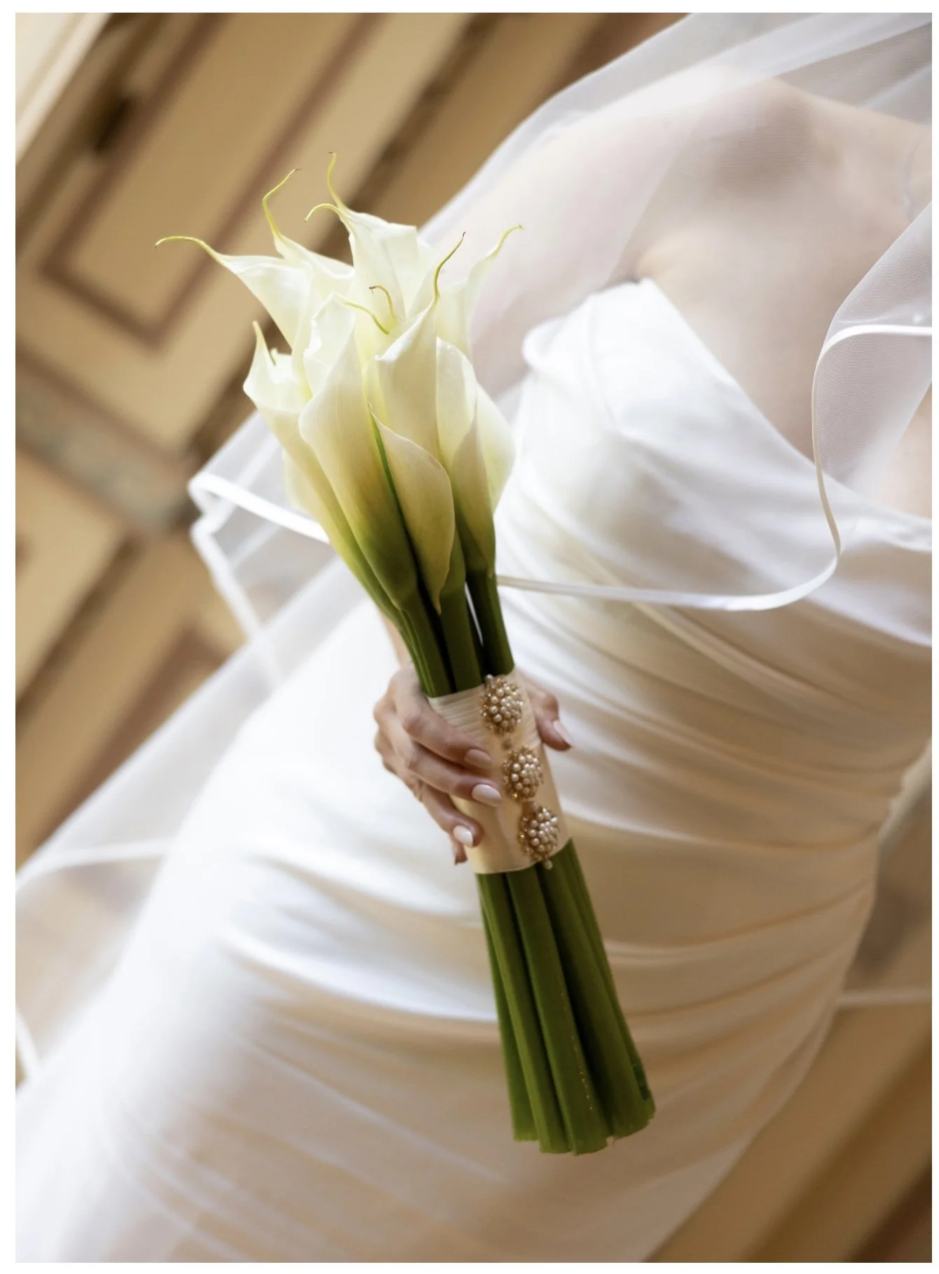 bride holding white bouquet.jpg
