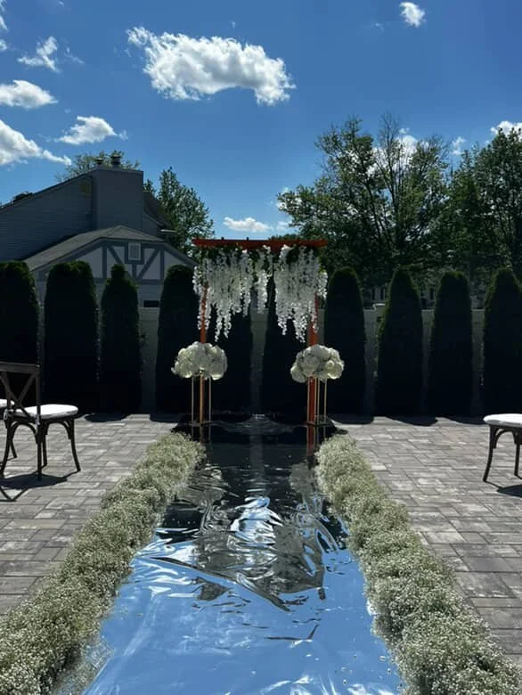 wedding ceremony aisle with white flowers.JPG
