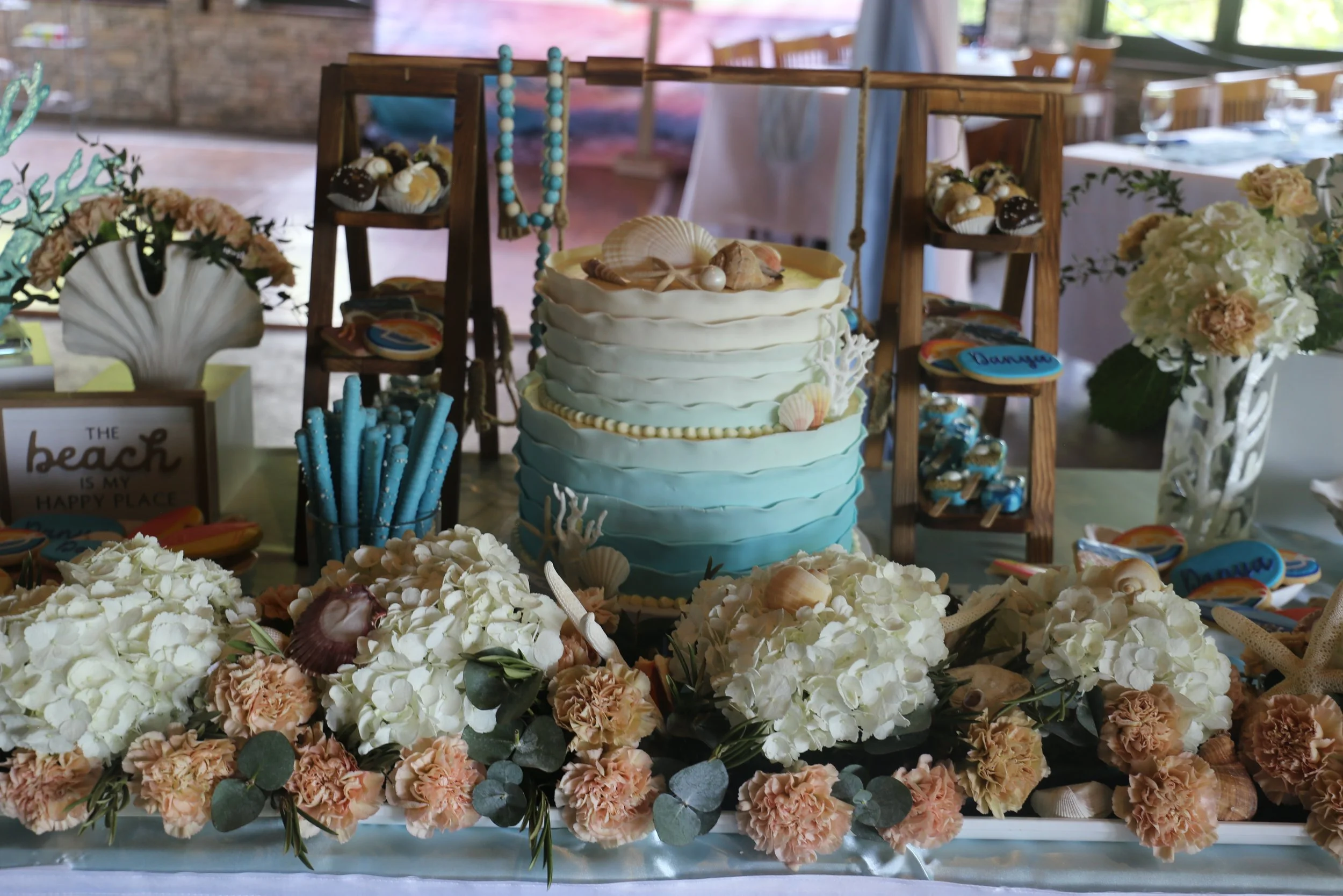 coastal themed cake table with ombre cake