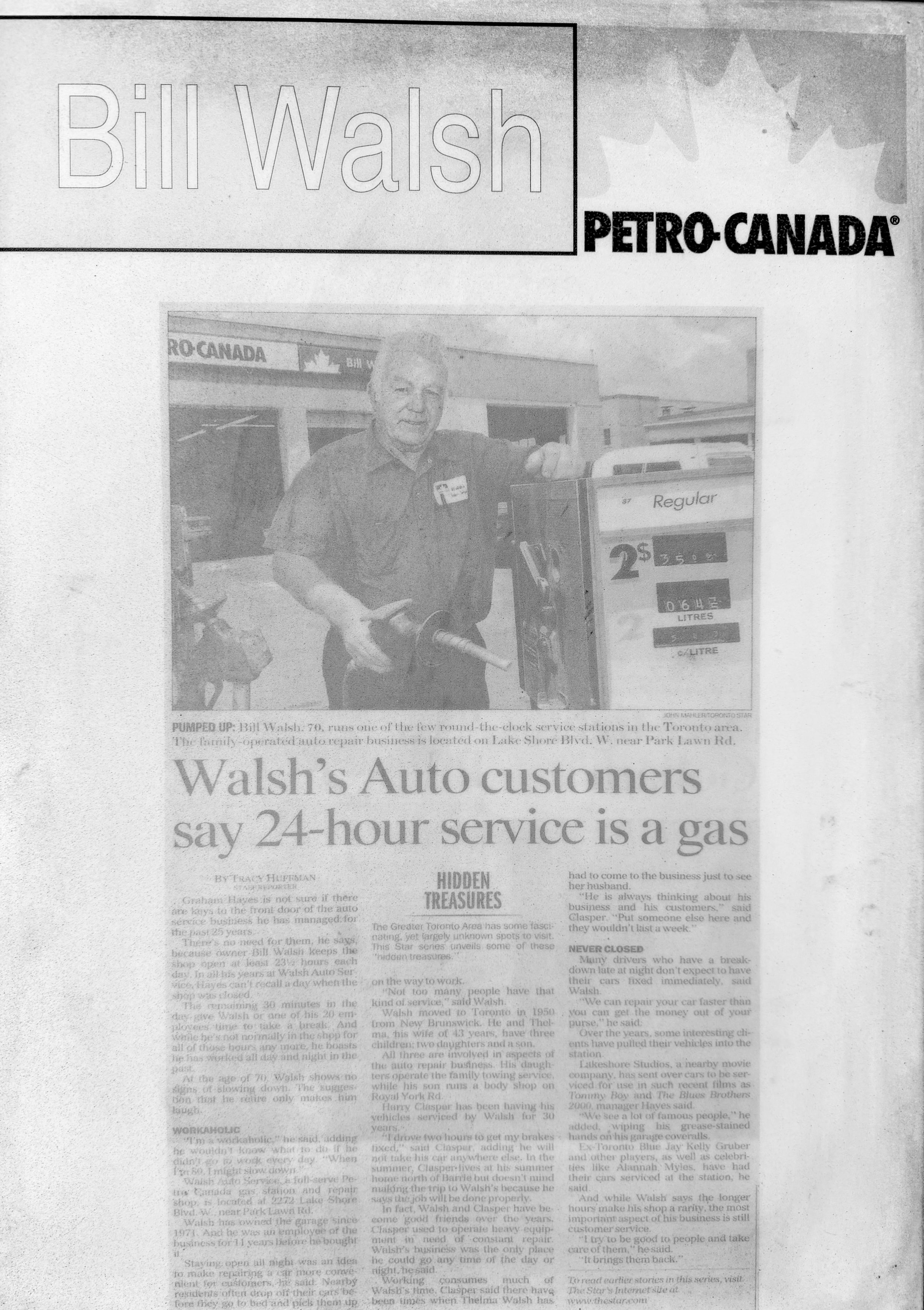 Black and white newspaper clipping of Bill Walsh standing next to a gas pump at a Petro-Canada station. Walsh is holding a gas nozzle and smiling. The headline mentions Walsh's auto repair business offering 24-hour service.