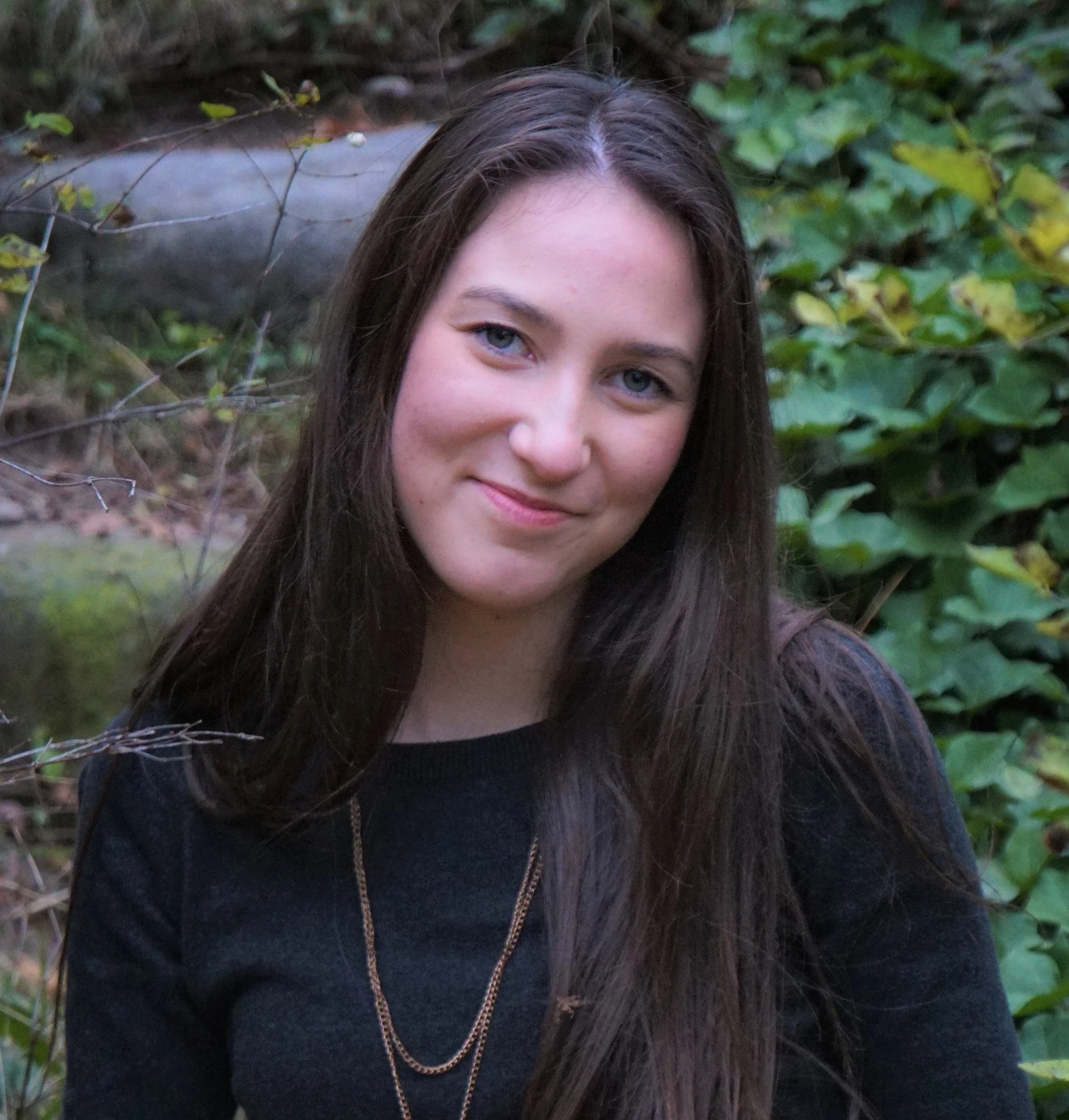 Esperanza Peck, Marketing Manager at Pacific Northwest Design and Build, smiling in a professional headshot.