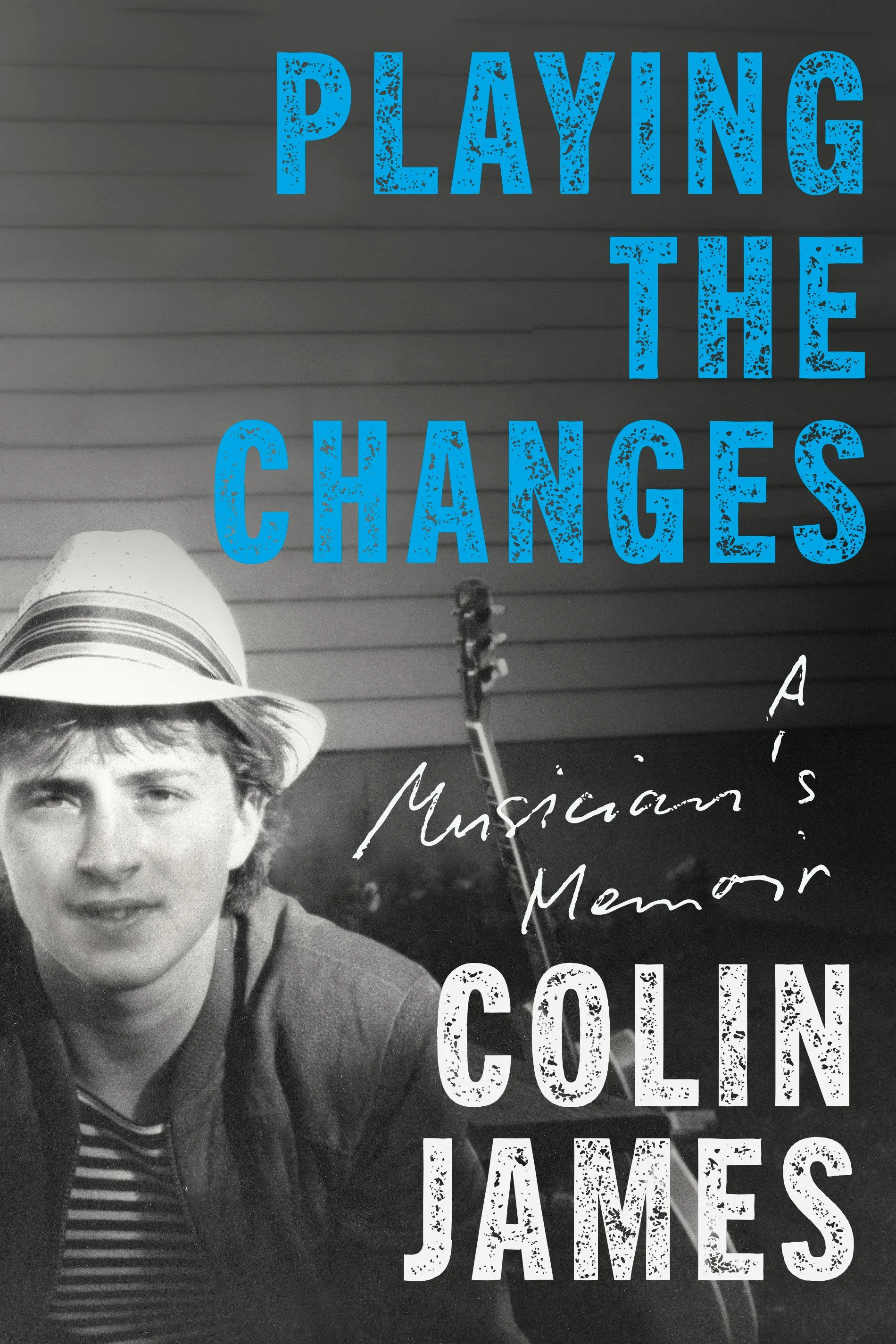 A young man wearing a beige hat and a blazer, smiling at the camera. Overlaid text reads 'Playing the Changes' in bold blue letters and other text reference is partially visible.