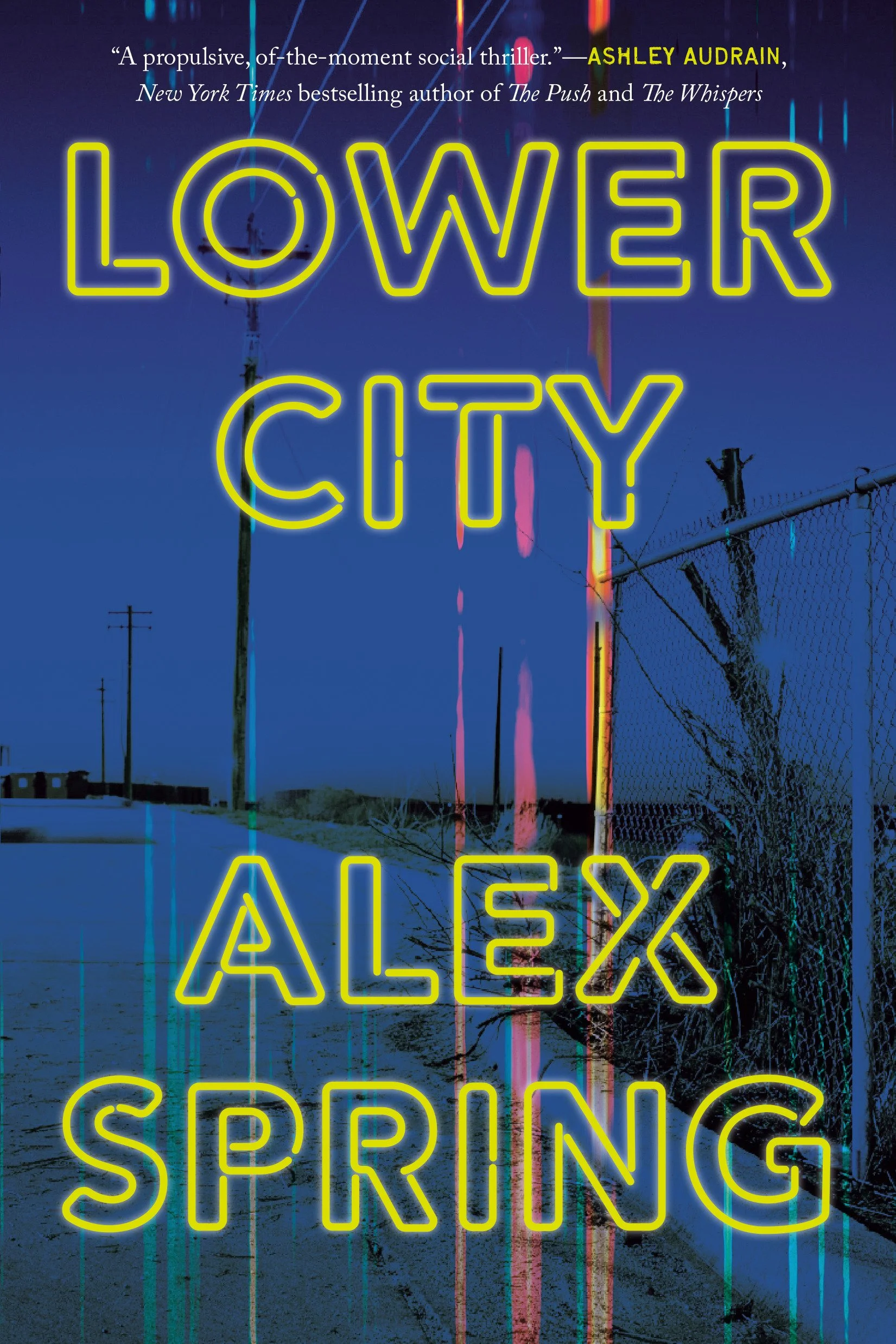 A dark outdoor scene with power lines, a fence, and trees silhouetted against the sky. Neon-style yellow text overlays the image that reads: "LOWER CITY ALEX SPRING," with a quote from Ashley Audrain at the top.