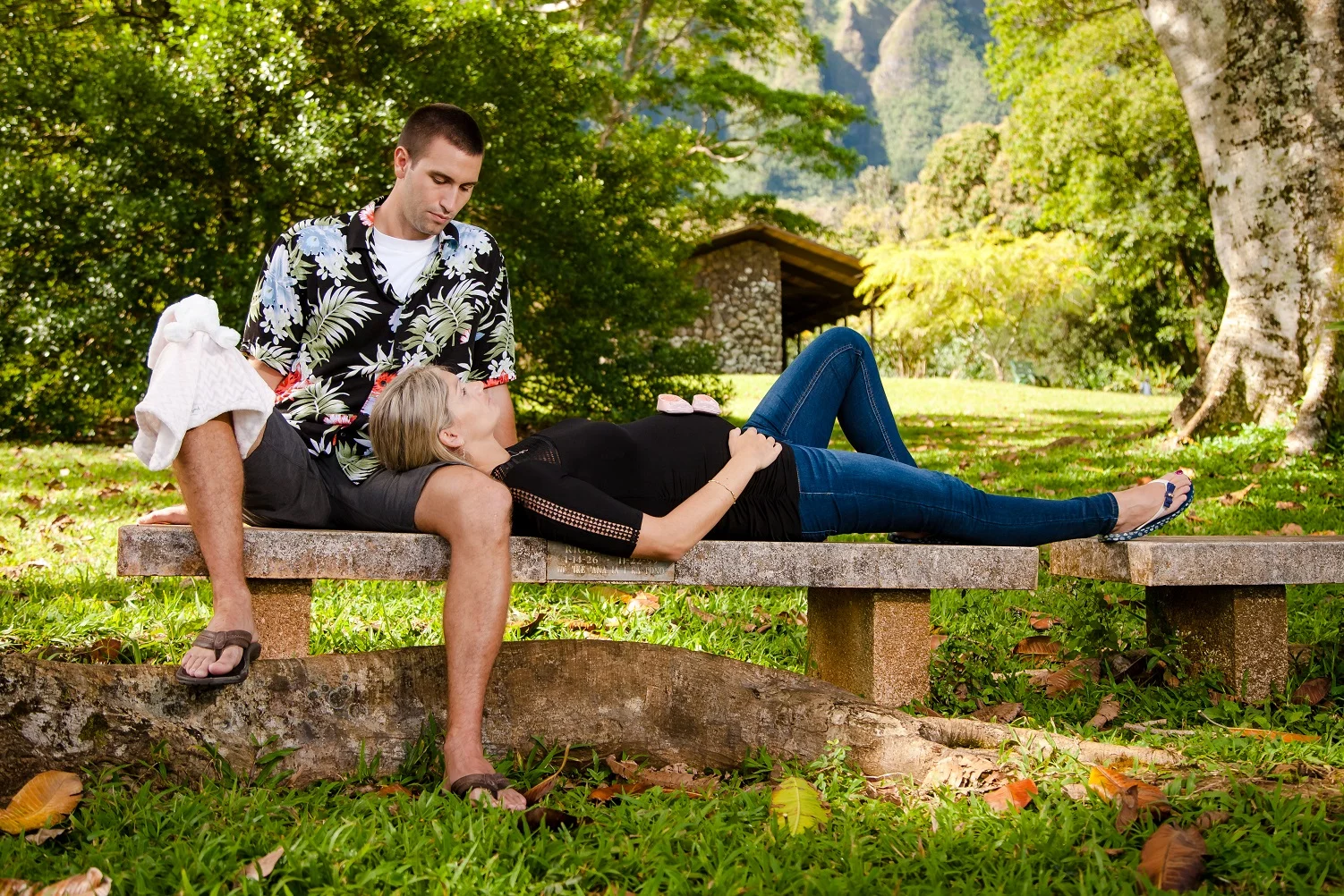 couple on park bench maternity expecting