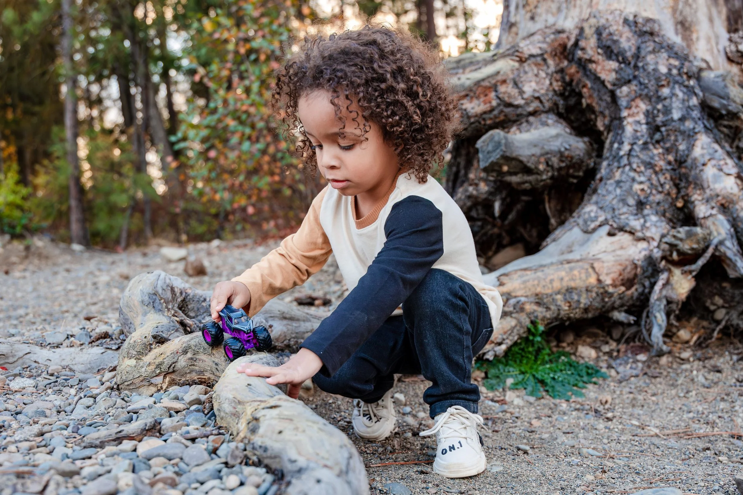 child playing spokane wa trees family photo session